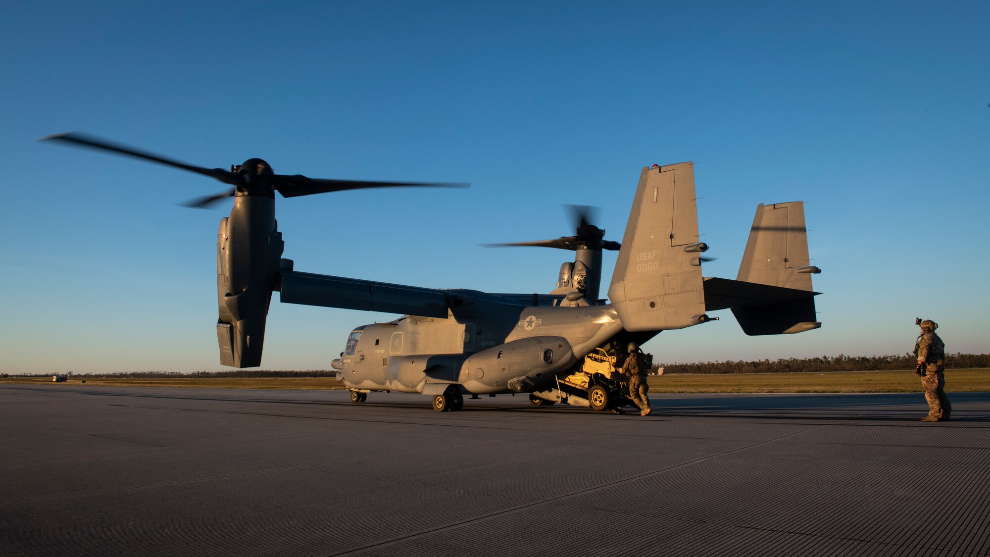 U.S. Air Force Special Tactics Airmen with the 23rd Special Tactics Squadron unload an all-terrain vehicle from a CV-22 Osprey tiltrotor aircraft assigned to the 8th Special Operations Squadron at Tyndall Air Force Base, Florida, Oct. 11, 2018.