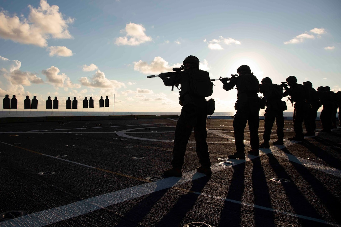 Marines with Battalion Landing Team, 1st Battalion, 2nd Marines, 22nd Marine Expeditionary Unit, conduct a life-fire “deck shoot” to enhance their combat effectiveness and readiness aboard the flight deck of the USS Arlington during Amphibious Ready Group/MEU Exercise in the Atlantic Ocean, Sept. 2, 2018. This training exercise enhances joint integration, lethality, and the collective capabilities of the Navy-Marine Corps team through joint planning and execution of challenging and realistic training scenarios in preparation for their upcoming deployment.
