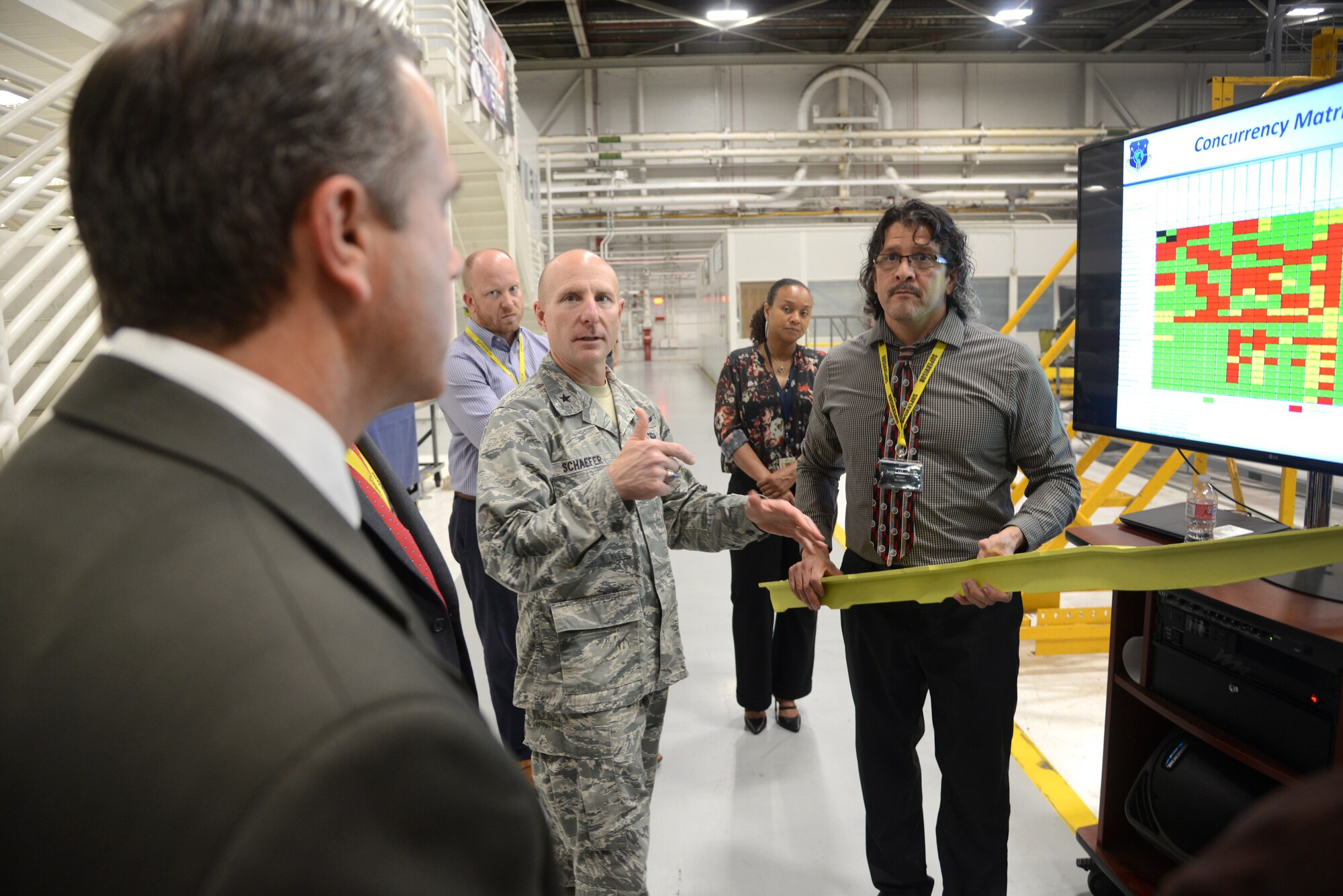Air Force Materiel Command Deputy Commander Brig. Gen. Carl E. Schaefer visited Tinker Oct. 1-3 and was given an immersion of the Air Force Sustainment Center, including the 72nd Air Base Wing, the Oklahoma City Air Logistics Complex and the Air Force Life Cycle Management Center offices. He was briefed at several locations, including the KC-135 programmed depot maintenance line and the R.E.A.C.T. Cell, the Gott Gate and Truck Gates and the KC-46 overlook and MROTC to gain a better understanding of readiness challenges to the Air Force enterprise as well as a look into business innovations. Here, Mark Estorga, 564th Aircraft Maintenance Squadron Civilian Leader, shows Schaefer a keel beam from a KC-135 that has been reversed engineered and manufactured using Art of the Possible processes.