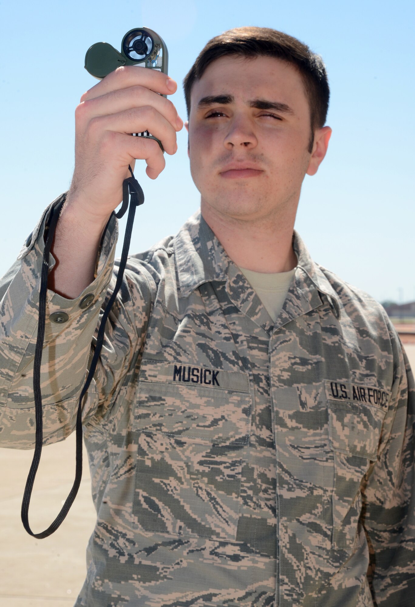 Airman Tyler Musick, weather apprentice for the 72nd Operations Support Squadron Weather Flight, uses a Kestrel handheld meter to observe to track environmental conditions at Tinker. (U.S. Air Force photo/Kelly White)