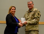 Joanna Otero-Cruz receives an award from Army Brig. Gen. Mark Simerly, DLA Troop commander, during this year’s Hispanic Heritage Month program in Philadelphia October 11, 2018.