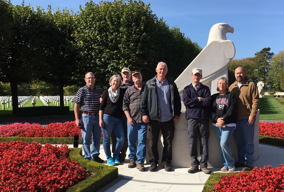 Group at cemetery facing viewer