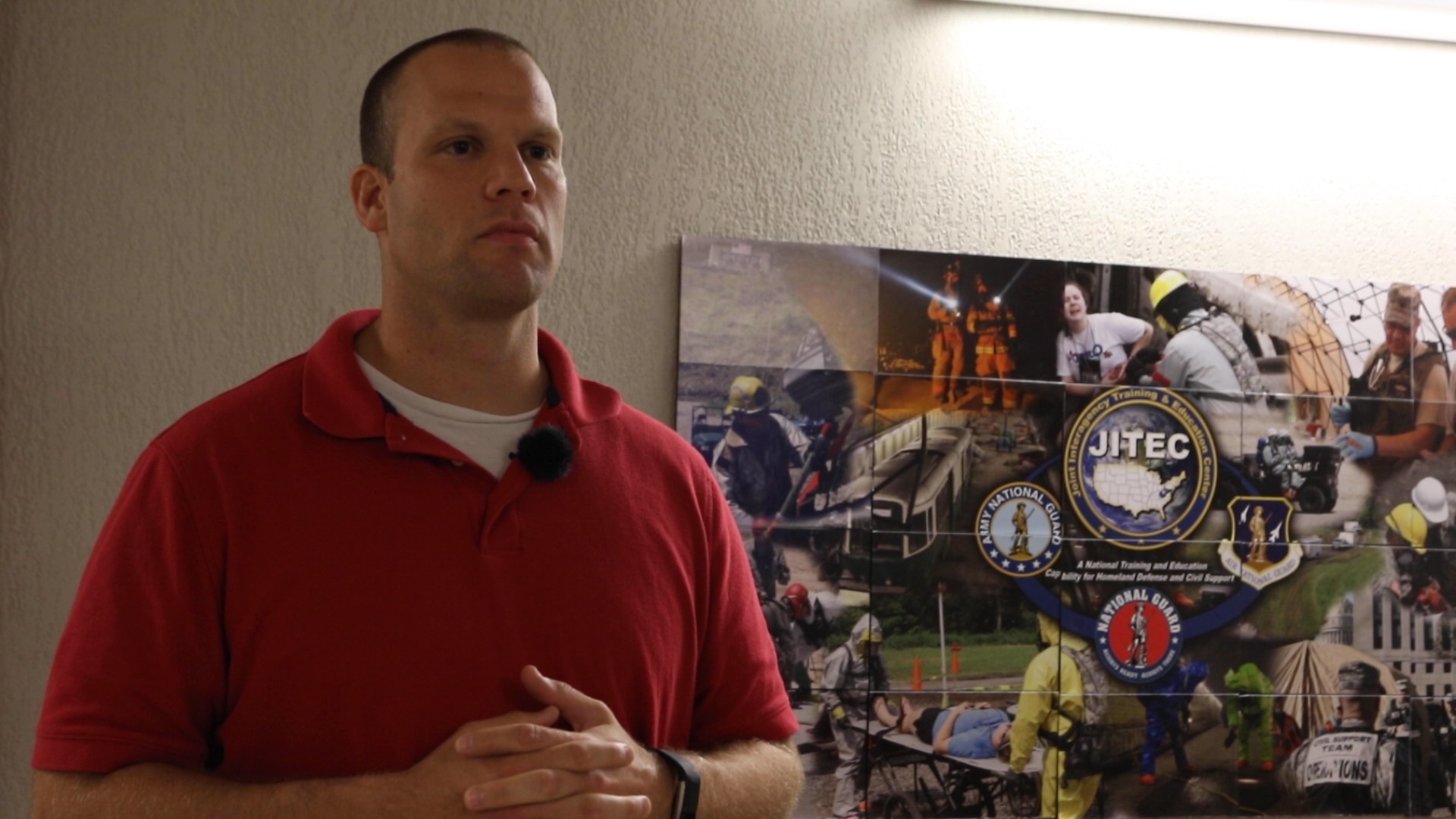 Maj. Christopher Parker, Executive Officer for AITEC’s CBRNE Battalion, speaks on the role of the West Virginia National Guard's Army Interagency Training and Education Center deployment in response to Hurricane Michael Oct. 11, 2018 at the St. Albans Armory in St. Albans, West Virginia.