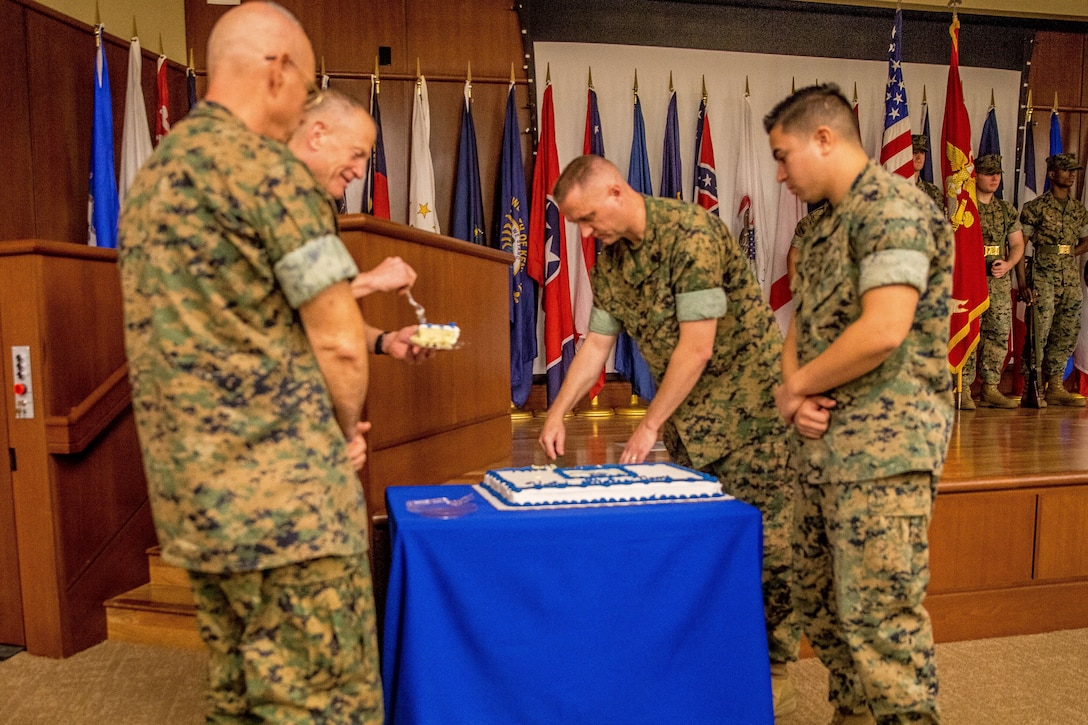 Maj. Gen. Burke W. Whitman, commander of Marine Forces Reserve and Marine Forces North, receives the first piece of cake at the Navy Birthday Cake Cutting Ceremony at Marine Corps Support Facility New Orleans, La., Oct. 12, 2018. Marines and sailors with Marine Corps Support Facility honor and celebrate the Navy’s 243rd Birthday with a traditional cake cutting ceremony. (U.S. Marine Corps photo by Lance Cpl. Samantha Schwoch/released)