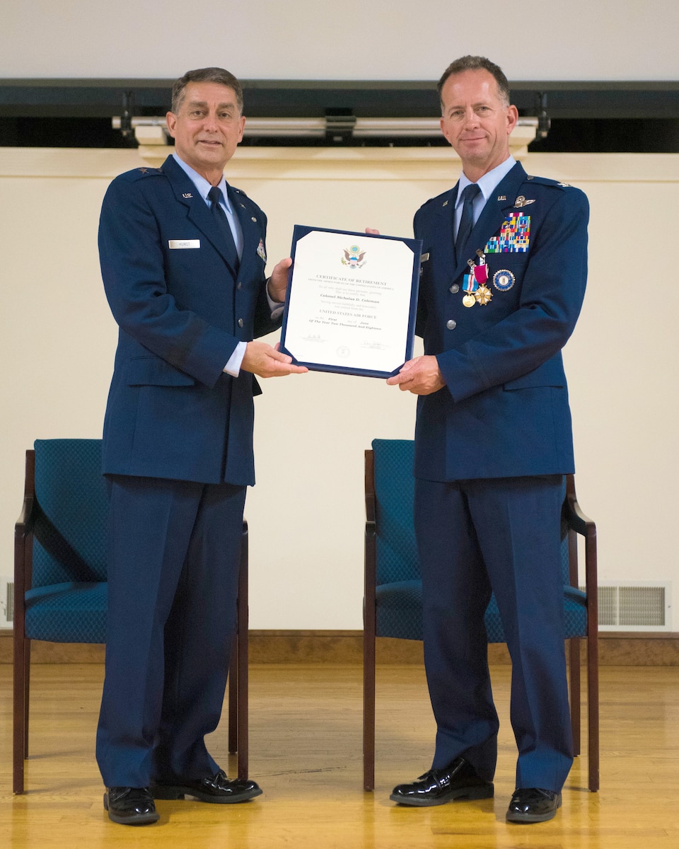 Brig. Gen. Warren Hurst (left), Kentucky's assistant adjutant general for Air, presents the certificate of retirement to Col. Nicholas Coleman during Coleman’s retirement ceremony at the Kentucky Air National Guard Base in Louisville, Ky., Sept. 15, 2018. Coleman’s career spanned more than 30 years in both the active-duty Air Force and Kentucky Air National Guard. (U.S. Air National Guard photo by Master Sgt. Vicky Spesard)