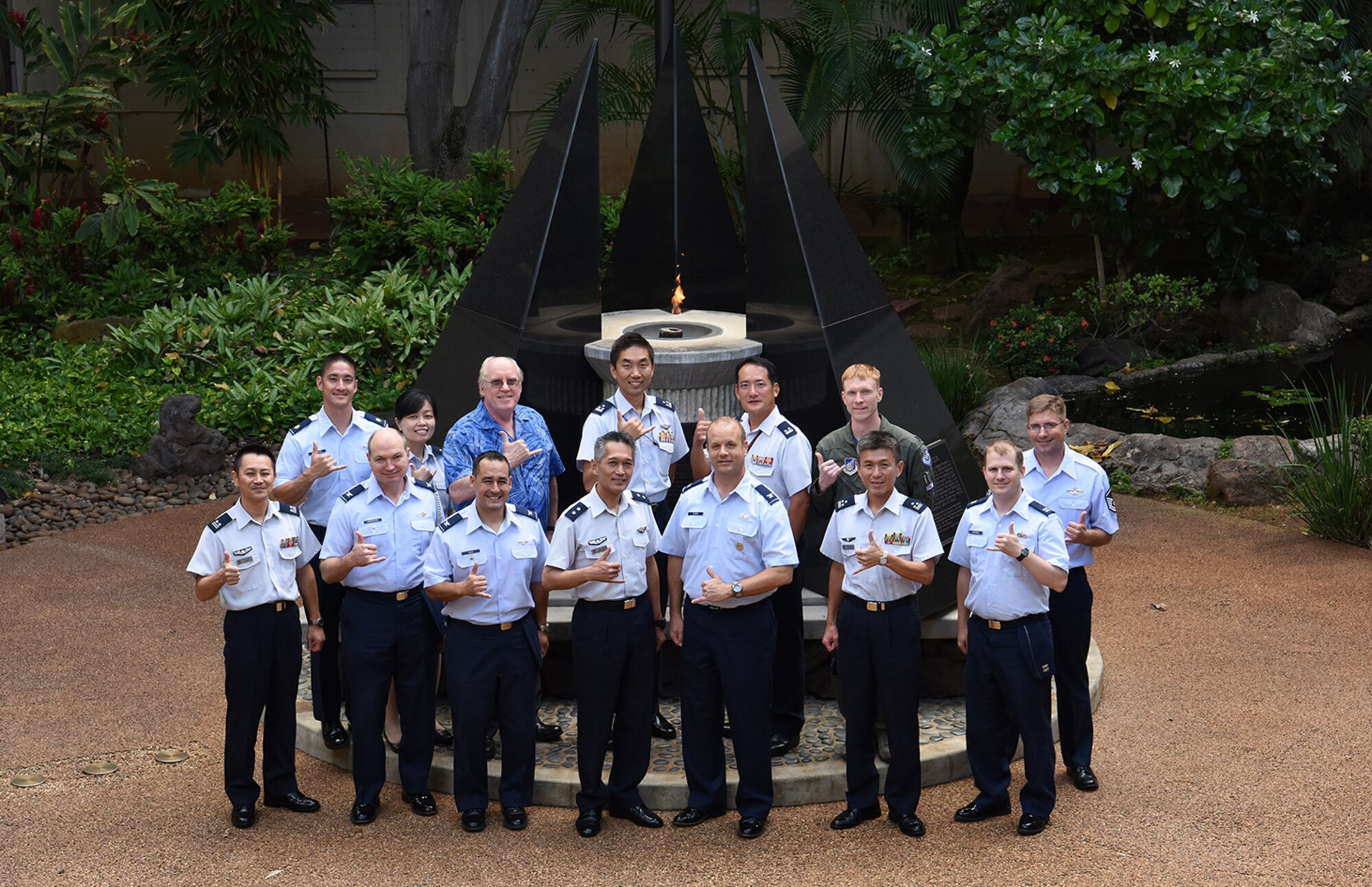 Koku Jieitai (Japan Air Self-Defense Force) and Pacific Air Forces Airmen pose for a photo in the Courtyard of Heroes during an exchange conference at Joint Base Pearl Harbor-Hickam, Hawaii, Oct. 5, 2018. The conference is part of the ‘Japanese and Americans in America’ visit, which allows attendees to share analytical assessments on issues of common concern and prepare for future opportunities to work together. (U.S. Air Force photo by Staff Sgt. Daniel Robles)