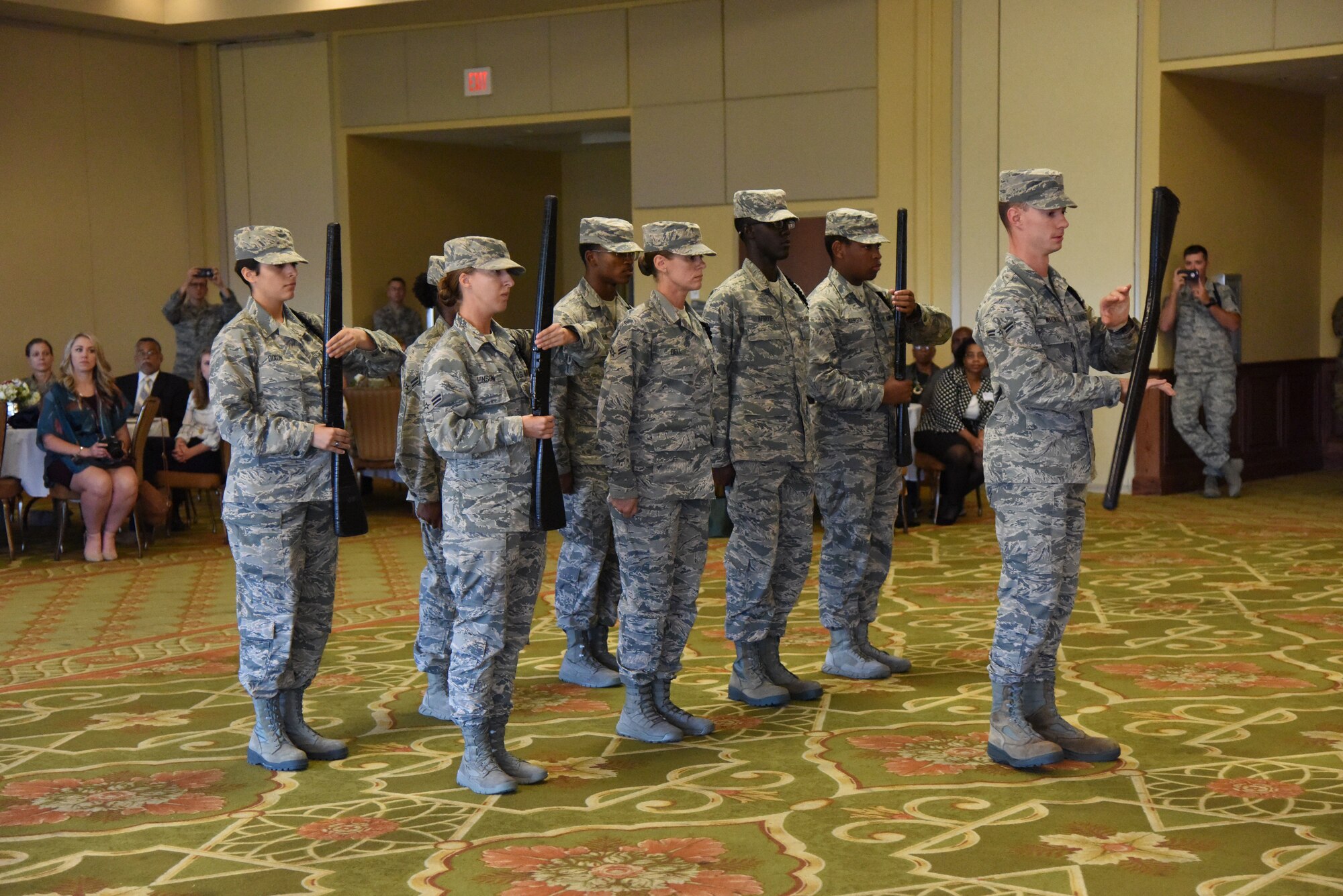 Members of the 335th Training Squadron drill team perform during the Biloxi Chamber Morning Call in the Bay Breeze Event Center at Keesler Air Force Base, Mississippi, Oct. 11, 2018. Local business and community leaders attended the event, hosted by the 81st Training Wing, to learn more about the base’s mission and its Airmen. (U.S. Air Force photo by Kemberly Groue)