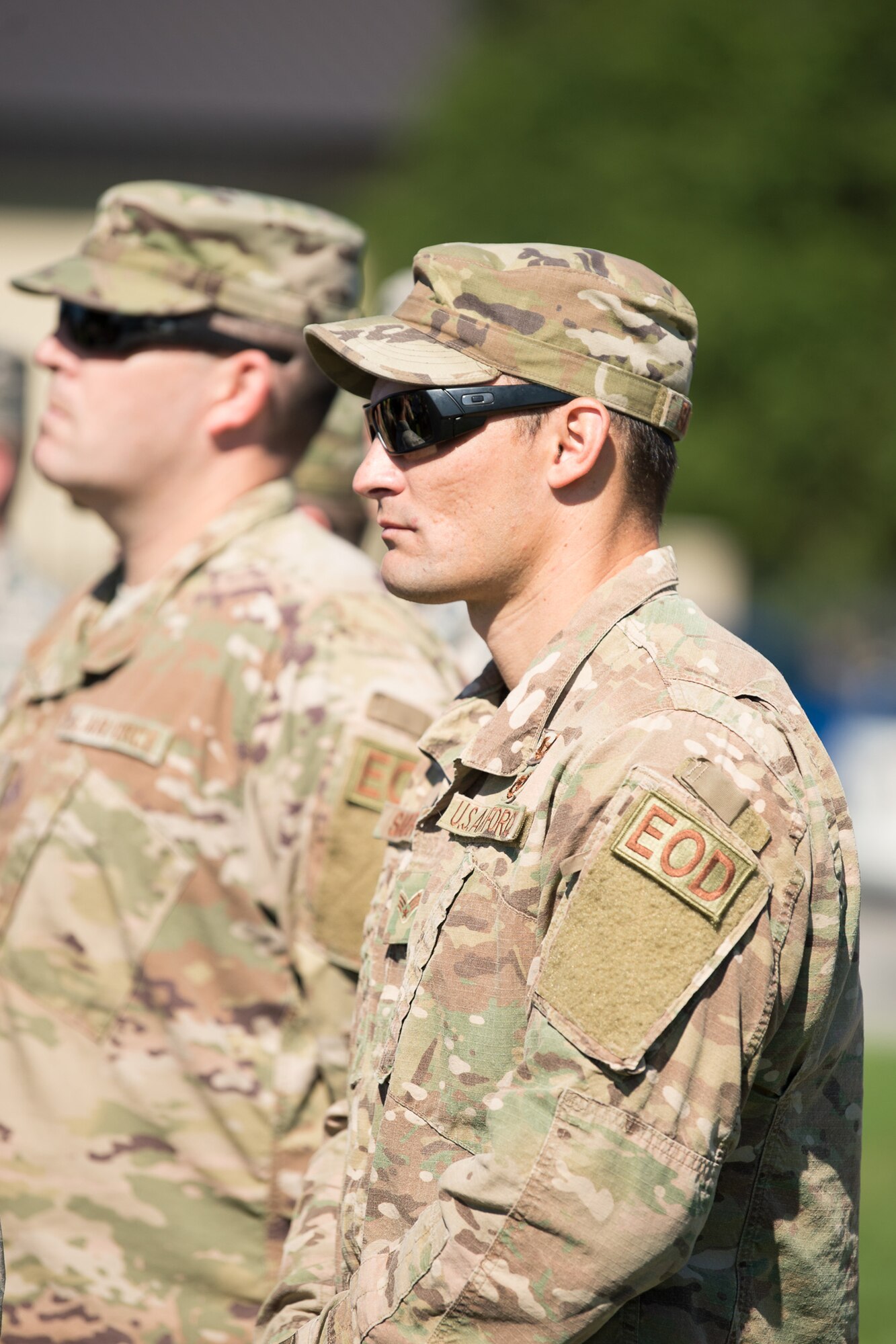 Airmen of the 436th Civil Engineer Squadron, Explosive Ordnance Flight listen to a speech by Delaware Governor John Carney during the Senior Airman Elizabeth Loncki bridge dedication ceremony Oct. 12, 2018, at Dover Air Force Base, Del.