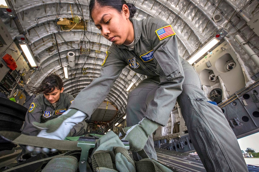 Staff Sgt. Belinda S. Son, right, 514th Aeromedical Evacuation Squadron aeromedU.S. Air Force Staff Sgt. Belinda S. Son (right), 514th Aeromedical Evacuation Squadron aeromedical evacuation technician, and Senior Airman Stephanie Lezcano, 45th AES aeromedical evacuation technician, strap down equipment on a C-17 Globemaster III prior to a joint training mission at Joint Base McGuire-Dix-Lakehurst, New Jersey, Oct. 5, 2018. (U.S. Air Force photo by Master Sgt. Mark C. Olsen)ical evacuation technician, and Senior Airman Stephanie Lezcano, 45th AES aeromedical evacuation technician, strap down equipment prior to a joint training mission with the 514th AES, 45th AES and the 439th AES at Joint Base McGuire-Dix-Lakehurst, N.J., Oct. 5, 2018. (U.S. Air Force photo by Master Sgt. Mark C. Olsen)