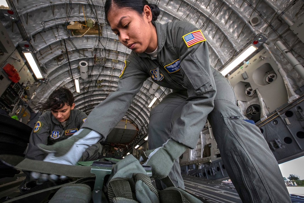 U.S. Air Force Staff Sgt. Belinda S. Son, right, an aeromedical evacuation technician with the 514th Aeromedical Evacuation Squadron (AES), 514th Air Mobility Wing, and Senior Airman Stephanie Lezcano, an aeromedical evacuation technician with the 45th AES, strap down equipment prior to a joint training mission with the 514th AES, 45th AES, and the 439th AES at Joint Base McGuire-Dix-Lakehurst, N.J., Oct. 5, 2018. The 514th is an Air Force Reserve Command unit. The 45th and the 439th AES are Air Force Reserve Command units from MacDill Air Force Base, Fla., and Westover Air Reserve Base, Mass. (U.S. Air Force photo by Master Sgt. Mark C. Olsen)