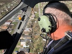 Bay County Sheriff’s Office Chief Pilot Larry Kennedy overlooks the damage caused by Hurricane Michael while conducting air surveillance with the Florida National Guard. Kennedy was accompanied by Guard members to assess the damage and to find the places that need the most support.