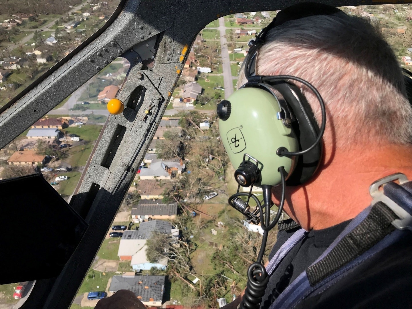 Bay County Sheriff’s Office Chief Pilot Larry Kennedy overlooks the damage caused by Hurricane Michael while conducting air surveillance with the Florida National Guard. Kennedy was accompanied by Guard members to assess the damage and to find the places that need the most support.