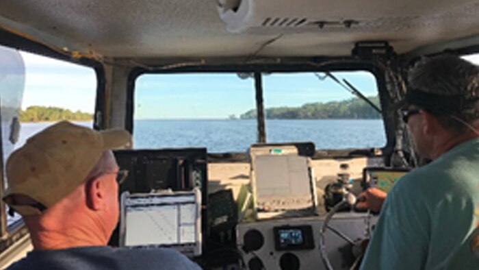 Irvington Site Office survey crew members survey the Gulf Intracoastal Waterway in the aftermath of Hurricane Michael.