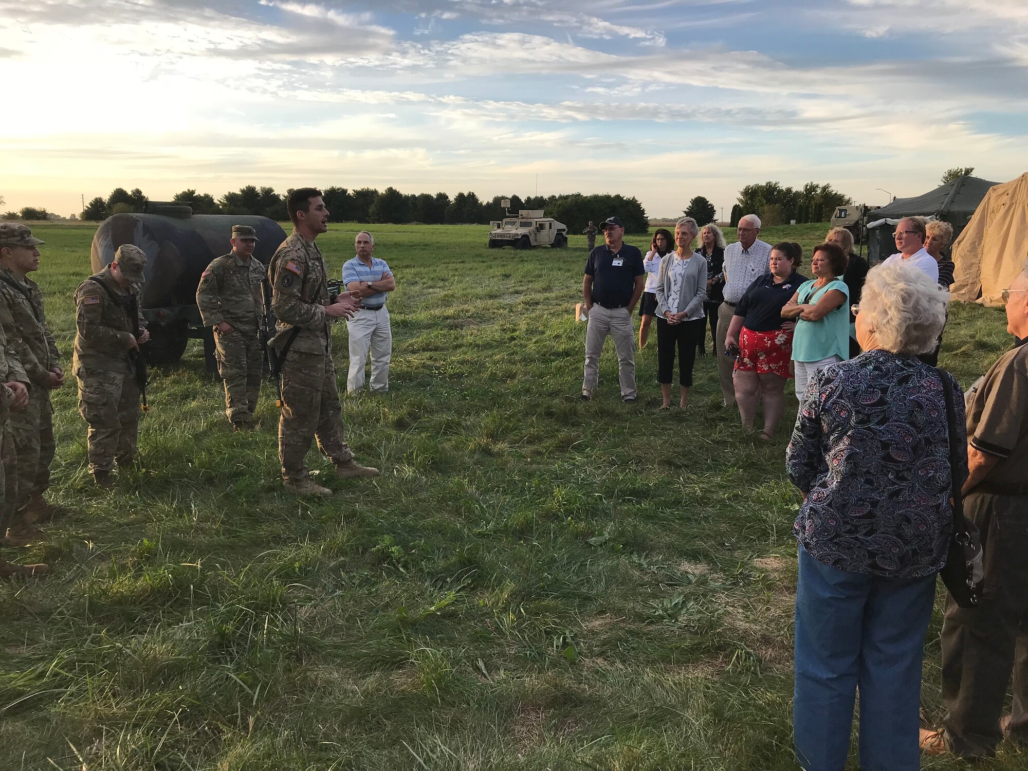 The 316th Psychological Operations Company speaks with members of the Grissom Community Council at Camp Atterbury-Muscatatuk, Ind., Sept. 21, 2018. As part of their quarterly general membership meeting, the GCC observed the 316th PSYOPs Company performing warrior skills training. (U.S. Air Force photo / Master Sgt. Benjamin Mota)