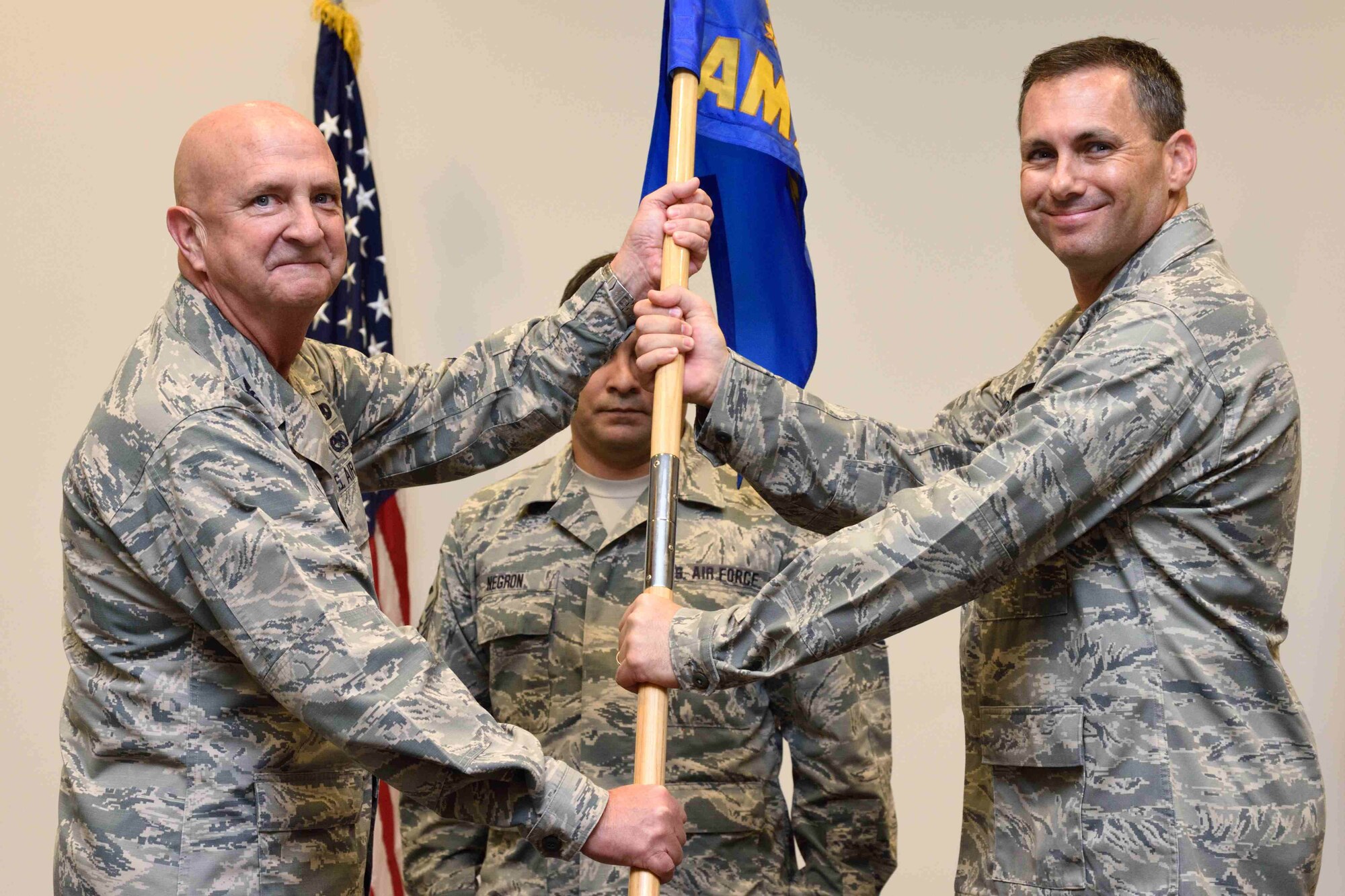Maj. Kelly Soich (right) takes the 403rd Aircraft Maintenance Squadron guidon from Col. Jay Johnson, 403rd Maintenance Group commander, during a change of command ceremony held Oct. 14, 2018, at the Roberts Consolidated Aircraft Maintenance Facility, Keesler Air Force Base, Mississippi. Soich took command of the 403rd AMXS after the previous commander, Maj. Adam Zeithammel, had been selected to fill a position with Air Force Special Operations Command. (U.S. Air Force photo by Tech. Sgt. Ryan Labadens)