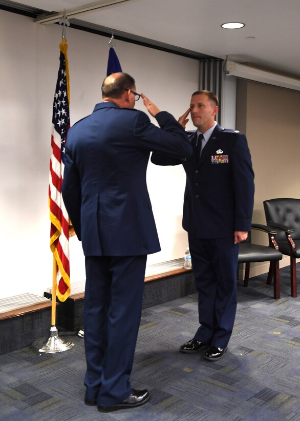 Lt. Col. Brett J. Dorey, commander of the 911th Force Support Squadron, salutes 911th Mission Support Group Commander Col. Kenneth M. Lute during his promotion ceremony at the Pittsburgh International Airport Air Reserve Station, Pennsylvania, Oct. 13, 2018. Dorey commands 80 Airmen and four flights to provide service, education and training, and quality of life programs to approximately 1,400 assigned personnel. (U.S. Air Force photo by Senior Airman Grace Thomson)