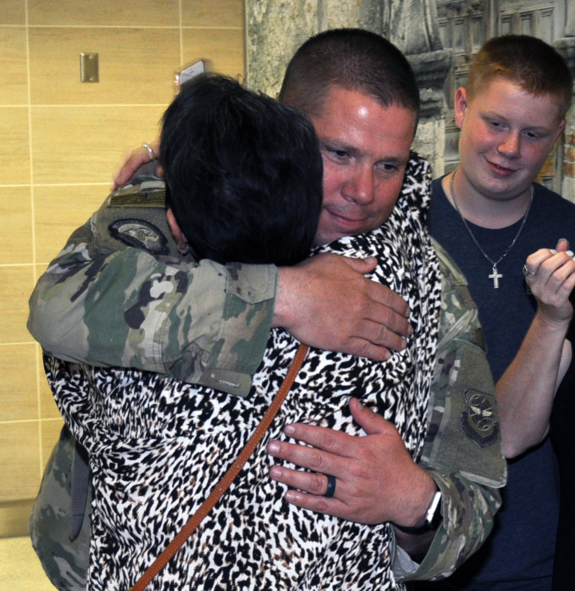 Tech. Sgt. Ryan Zak, 26th Aerial Port Squadron air transportation specialist, greets his son Joshua and extended family at the San Antonio International Airport after returning from deployment to Southwest Asia Oct. 12, 2018.