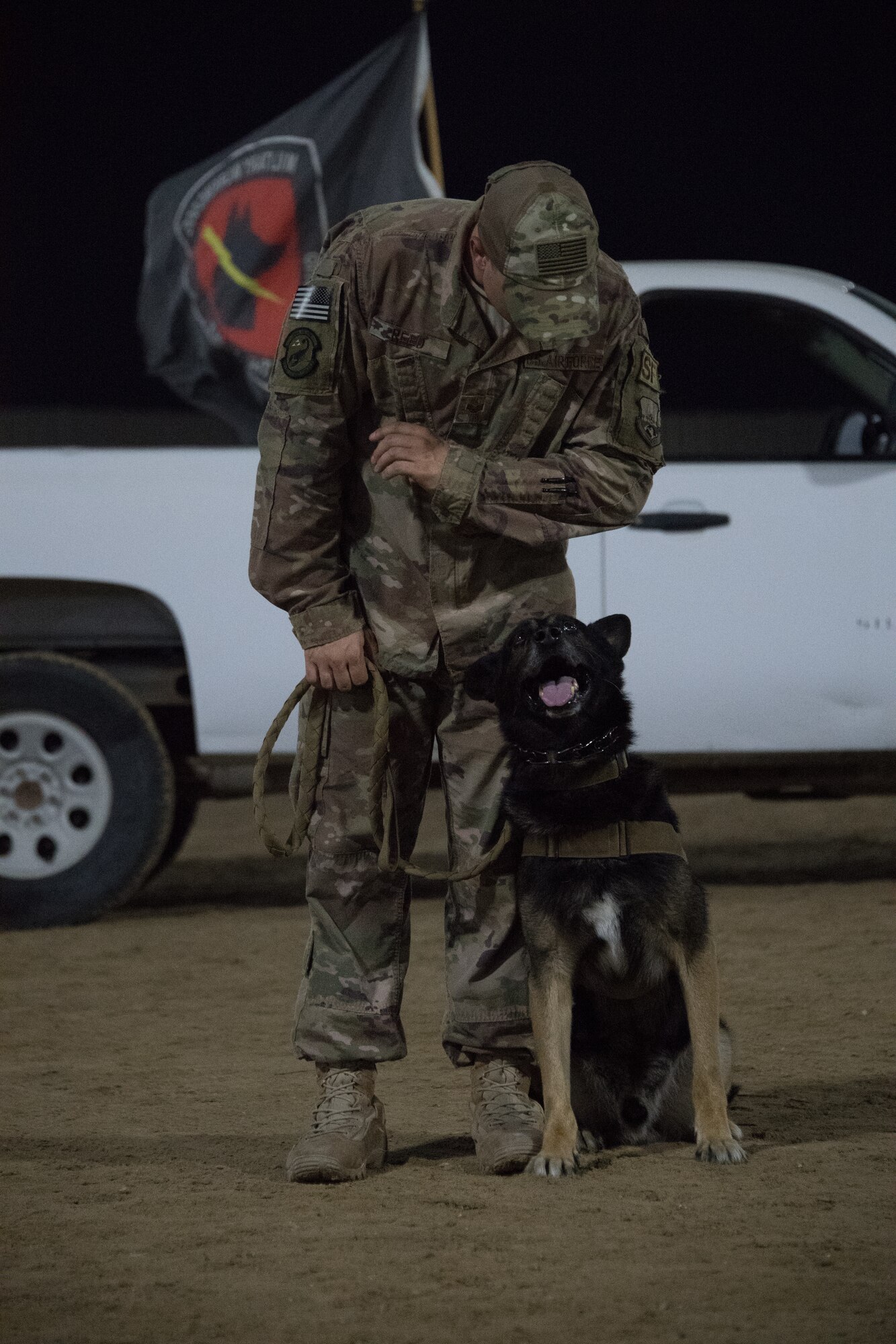 U.S. Air Force military working dog handler, Staff Sgt. Patrick Cushing, and working dog Tuka participate in a demonstration highlighting the capabilities of the team at Al Dhafra Air Base, United Arab Emirates, October 8, 2018. (U.S. Air Force photo by Tech. Sgt. Nieko Carzis)
