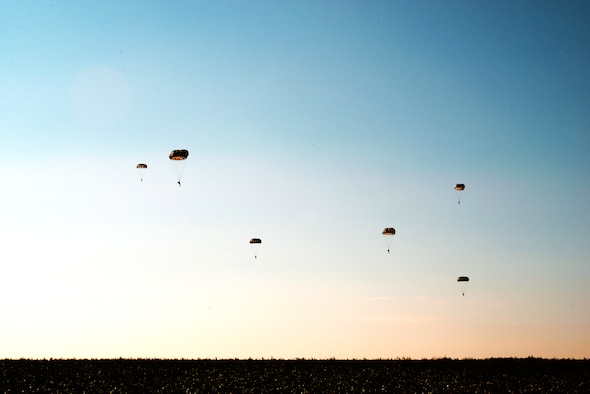 Parajumpers assigned to the 435th Air Ground Operations Wing descend upon a field at Chievres Air Base, Belgium, Oct. 4, 2018. Leaders at the 424th Air Base Squadron have been pushing to expand Supreme Headquarters Allied Powers Europe Airfield’s capacity to support airlift missions. (U.S. Air Force photo by Senior Airman Joshua Magbanua)