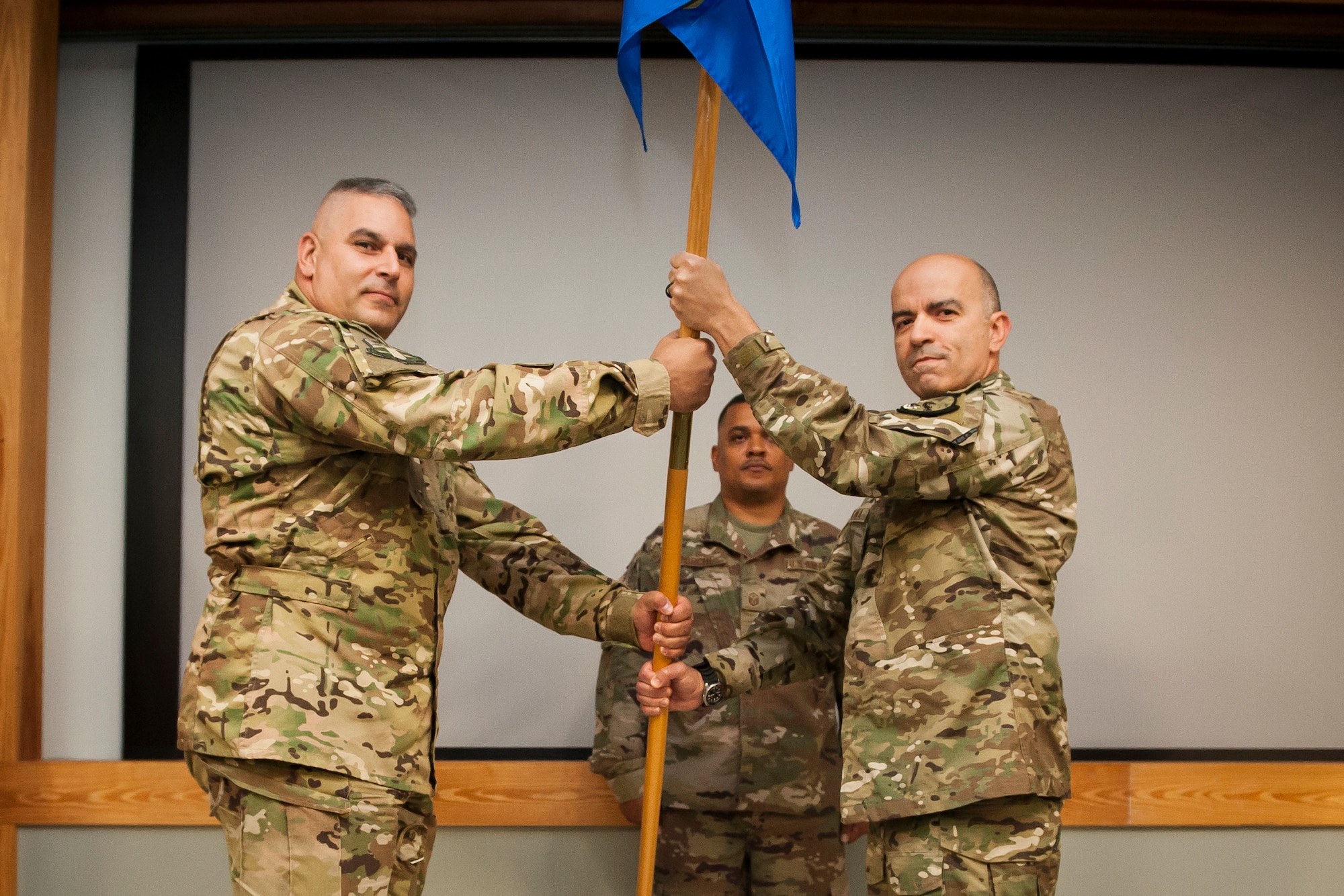 Lt. Col. Michael LoForti, 920th Operations Group commander, passes the unit’s guidon to the new 920th Operations Support Squadron Maj. Ricardo Montana during a change of command ceremony at Patrick Air Force Base, Florida, Oct. 13, 2018. During the ceremony the squadron’s Airmen sent off Lt. Col. Scott Nichols, the previous 920th OSS, to the 301st Rescue Squadron. (U.S. Air Force photo by Tech. Sgt. Jared Trimarchi)