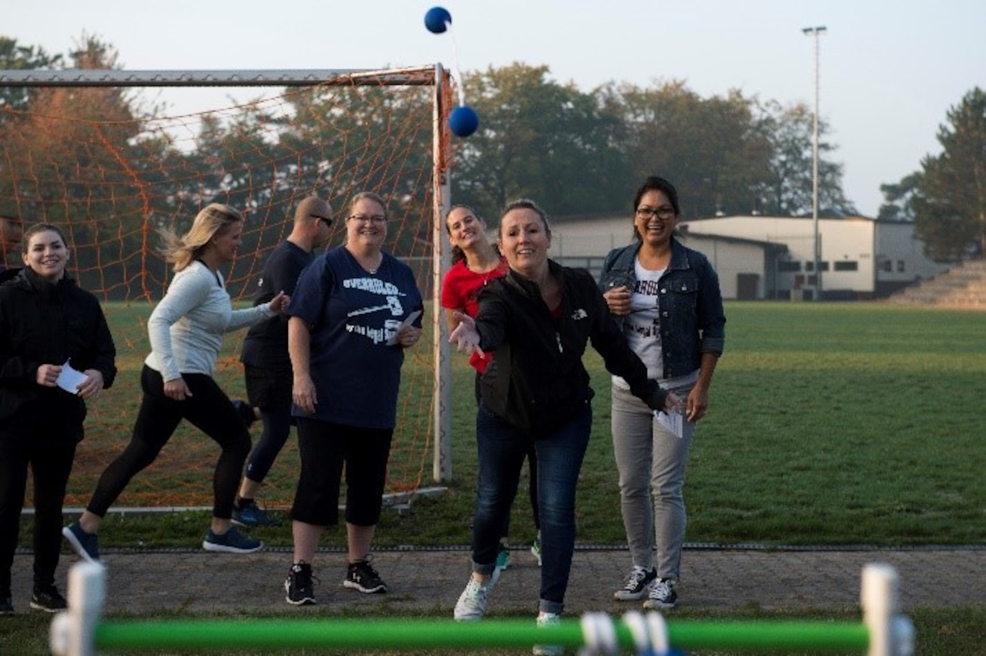 Danielle Struckel, a Team Ramstein spouse, throws a round of Ladder Ball during The Amazing Base competition on Ramstein Air Base, Germany, Oct. 10, 2018. The Amazing Base teams completed challenges and solved riddles around the base.