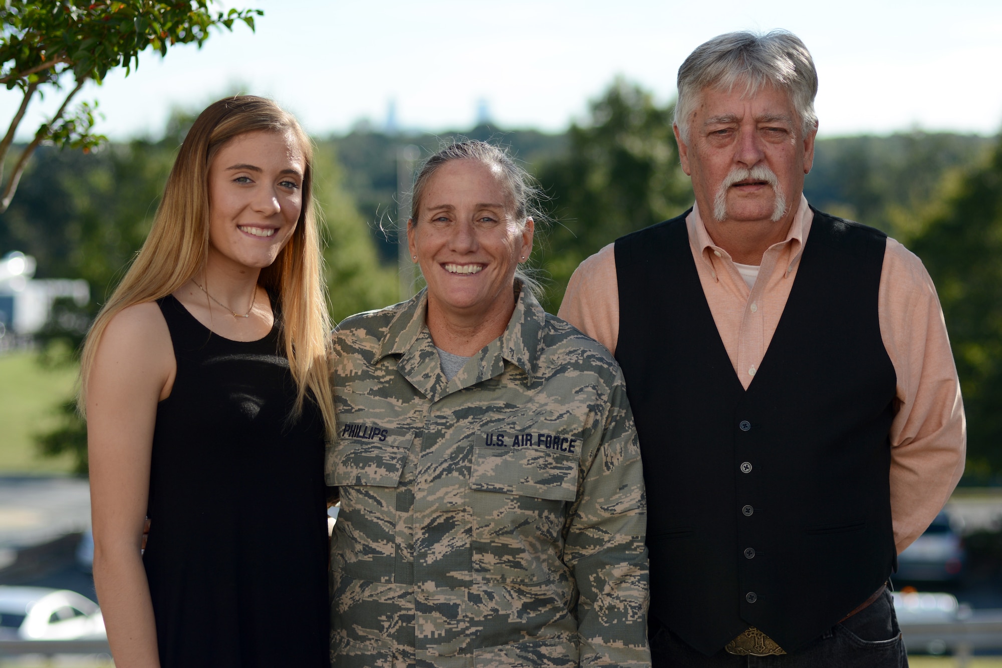 U.S. Air Force Chief Master Sgt. Lisa Phillips (center) poses for family pictures following her recent promotion at the North Carolina Air National Guard Base, Charlotte Douglas International Airport, Oct. 13, 2018. Phillips is the first female Chief Master Sgt. ever assigned to the 145th Maintenance Group.