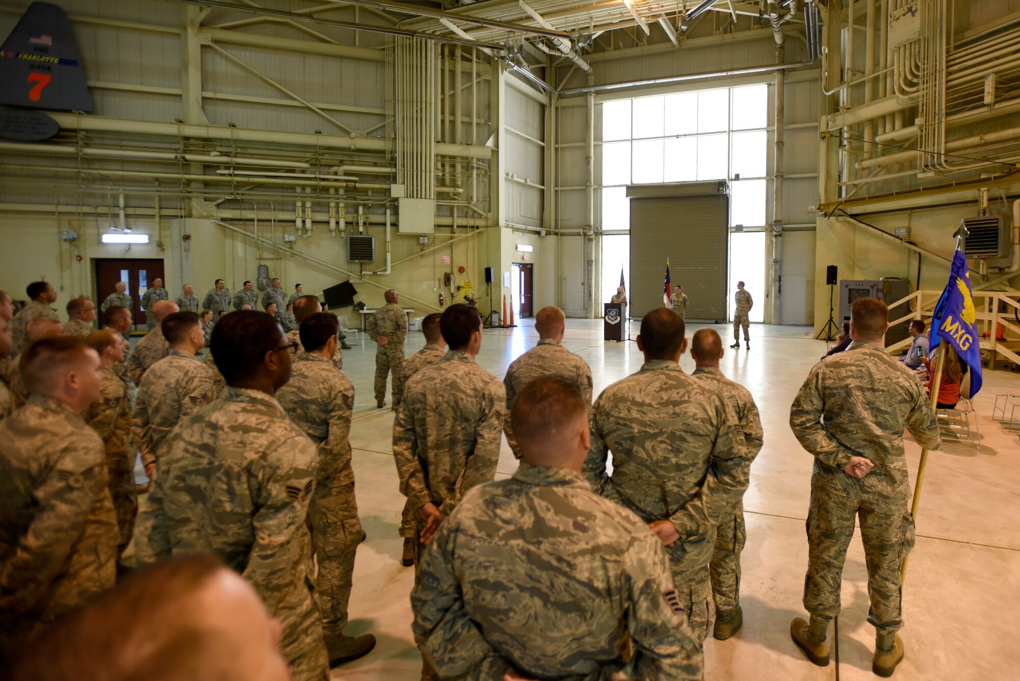 Friends and family of the North Carolina Air National Guard listen as U.S. Air Force Chief Master Sgt. Lisa Phillips gives a moving speech during her promotion ceremony at the North Carolina Air National Guard Base, Charlotte Douglas International Airport, Oct. 13, 2018. Phillips is the first female Chief Master Sgt. ever assigned to the 145th Maintenance Group.