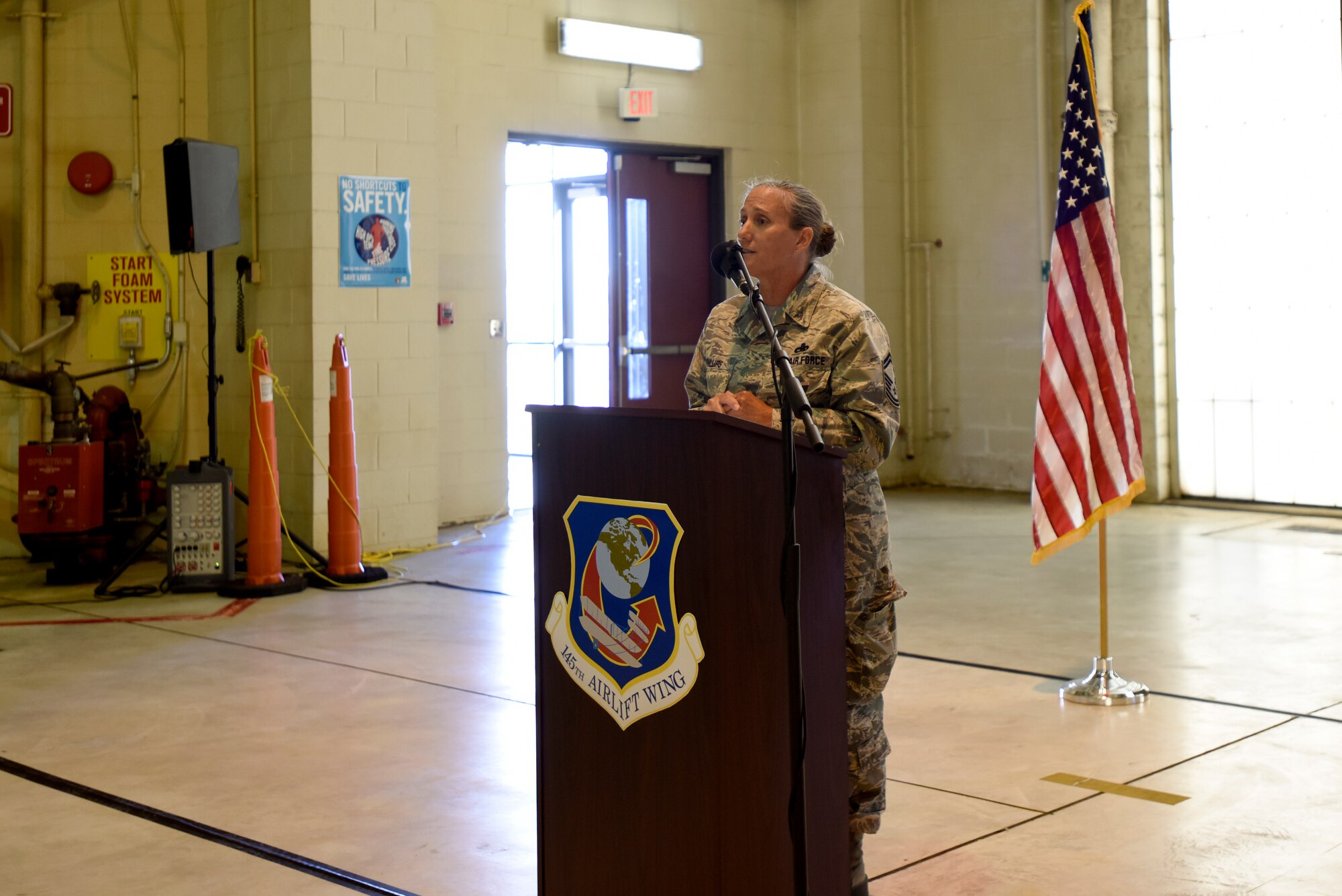 Friends and family of the North Carolina Air National Guard listen as U.S. Air Force Chief Master Sgt. Lisa Phillips gives a moving speech during her promotion ceremony at the North Carolina Air National Guard Base, Charlotte Douglas International Airport, Oct. 13, 2018. Phillips is the first female Chief Master Sgt. ever assigned to the 145th Maintenance Group.