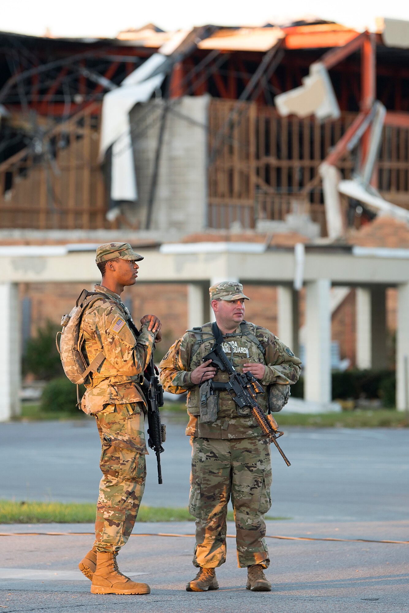 53rd Infantry Brigade Combat Team soldiers provide security for the 290th Joint Communications Support Squadron in Panama City, Fla., Oct. 13, 2018. The 290th JCSS from MacDill Air Force Base established initial communications for the Bay County Emergency Operations Center to enable Total Force relief efforts following Hurricane Michael. (U.S. Air Force photo by Airman 1st Class Caleb Nunez)