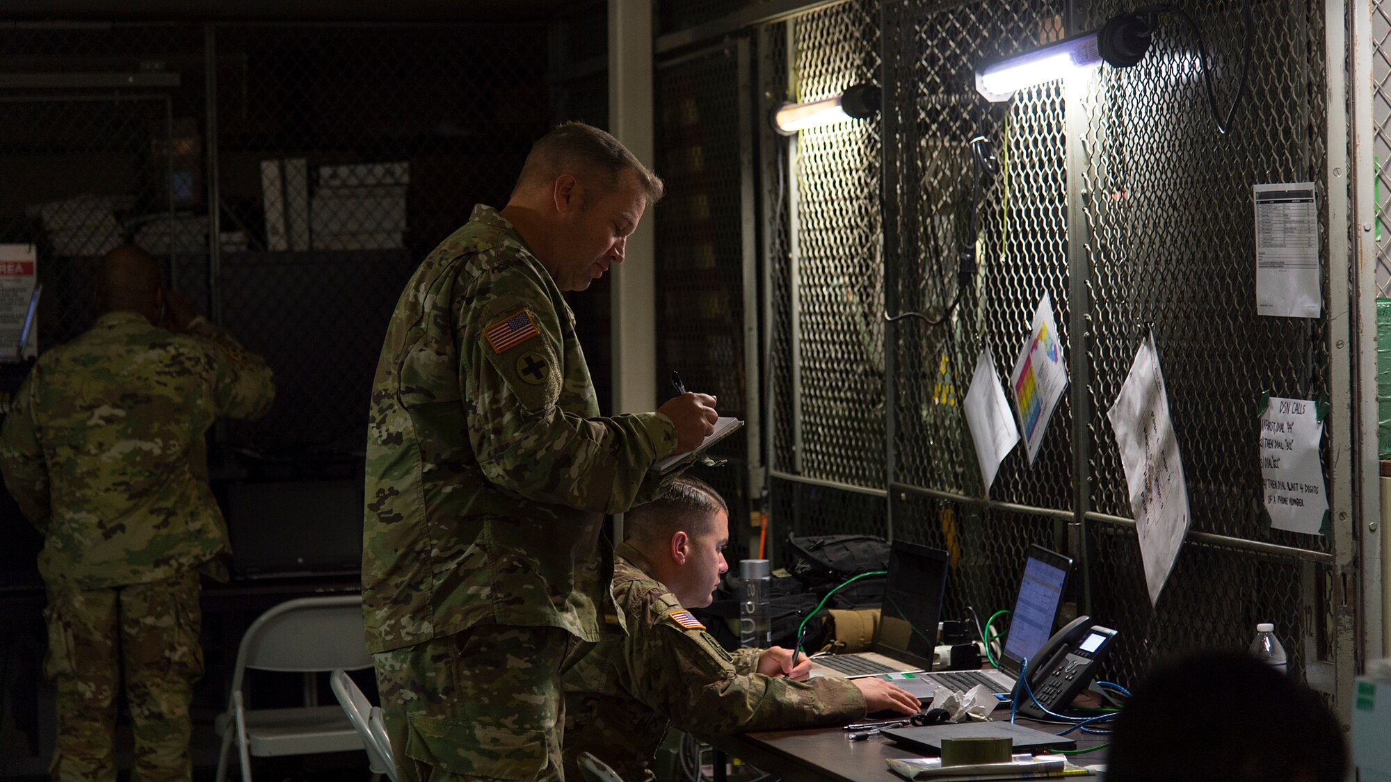 U.S. Army National Guard Soldiers coordinate response teams at the Florida National Guard Armory tactical operations center in Panama City, Fla., Oct. 13, 2018. The 290th Joint Communications Support Squadron and the Joint Communications Support Element from MacDill Air Force Base restored TOC communications capabilities several days prior, enabling command and control for relief efforts. (U.S. Air Force photo by Airman 1st Class Caleb Nunez)