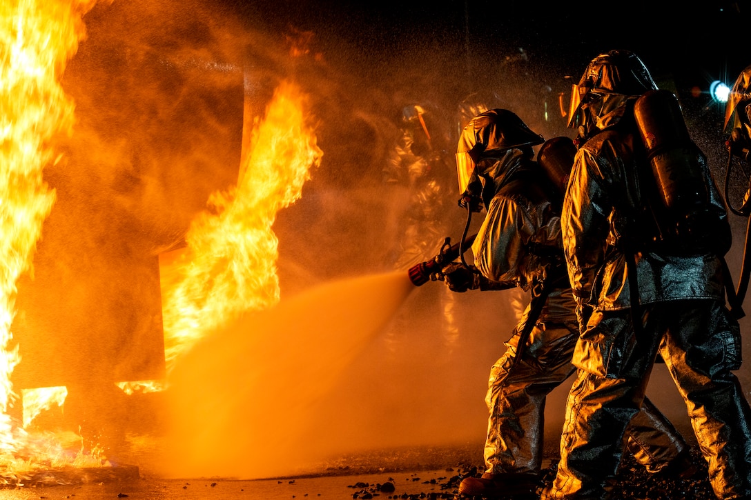 Aircraft Rescue and Firefighting Marines with Headquarters and Headquarters Squadron conduct fire containment drills at Marine Corps Air Station Iwakuni, Japan, Oct. 12, 2018. The training was conducted in order to maintain proficiency extinguishing aircraft fires in support of the air station's mission of launching and recovering aircraft. ARFF is a special category of firefighting that involves the response, hazard mitigation, evacuation and possible rescue of passengers and crew of an aircraft involved in a ground emergency.