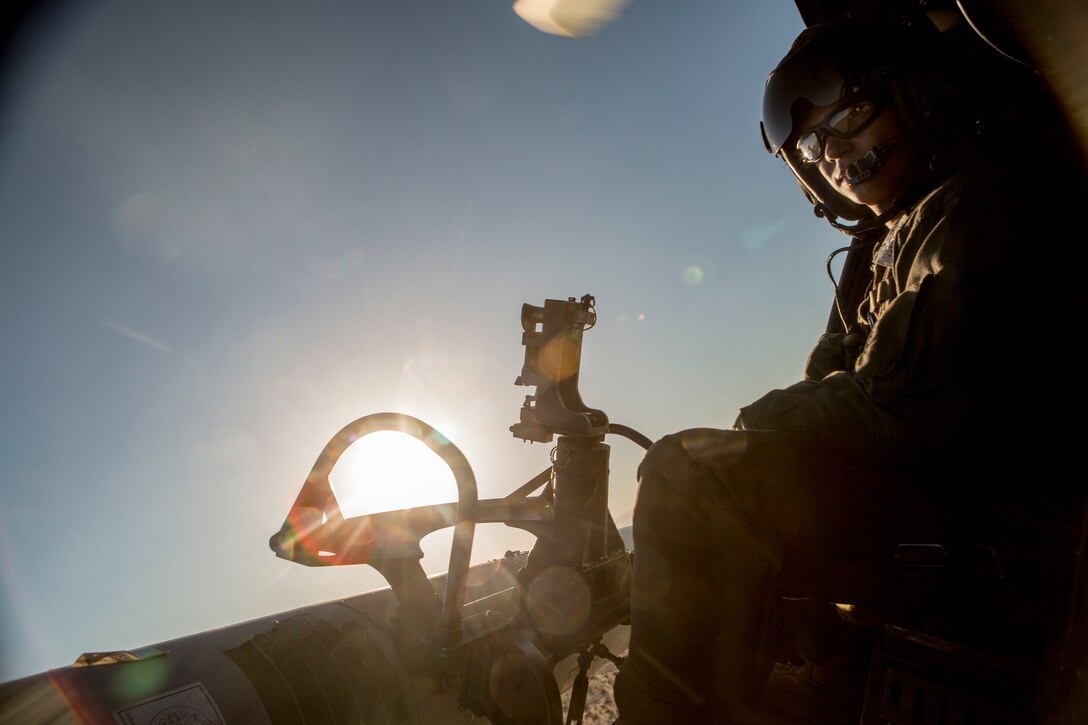 U.S. Marine Sgt. Nathan Piltz, a crew chief with Helicopter Marine Light Attack Training Squadron 303, serves as a second pair of eyes when landing the Bell UH-1Y Venom aircraft during Assault Support Tactics 4, as part of Weapons and Tactics Instructors Course 1-19 at Marine Corps Air-Ground Combat Center Twentynine Palms, Calif., Oct. 9, 2018. WTI, a seven week training event hosted by Marine Aviation Weapons and Tactics Squadron 1, emphasizes operational integration of the six functions of Marine Corps aviation in support of a Marine air-ground task force. This year, Marines and Sailors with the Special Purpose Marine Air-Ground Task Force Crisis Response-Central Command 19.1 served as the command element for WTI.