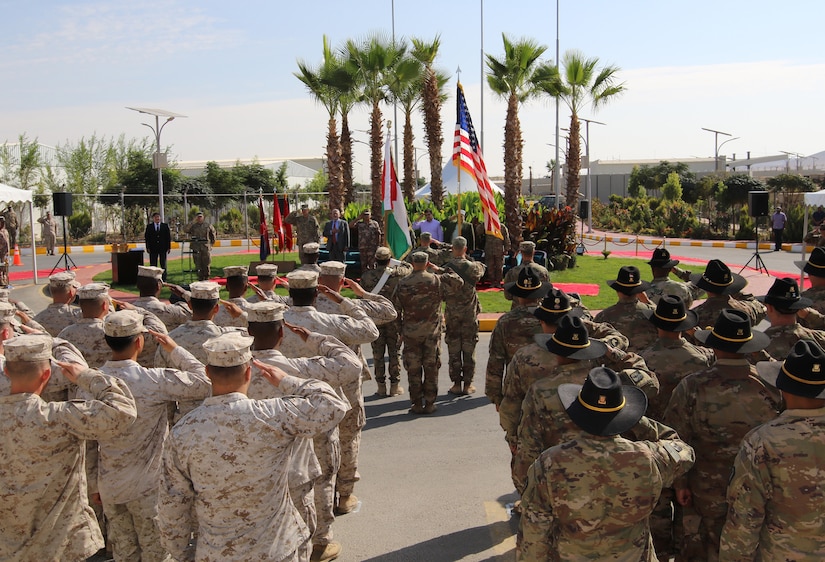 Jordan Armed Forces soldiers and U.S. military service members salute during the playing of the U.S. and Jordanian national anthems during a dedication ceremony for an expansion of the Jordan Armed Forces Joint Training Center Oct. 10, 2018. The new JTC wing provides U.S. service members a modern facility as U.S. forces and the Jordan Armed Forces continue to enhance interoperability by pursuing training opportunities together.