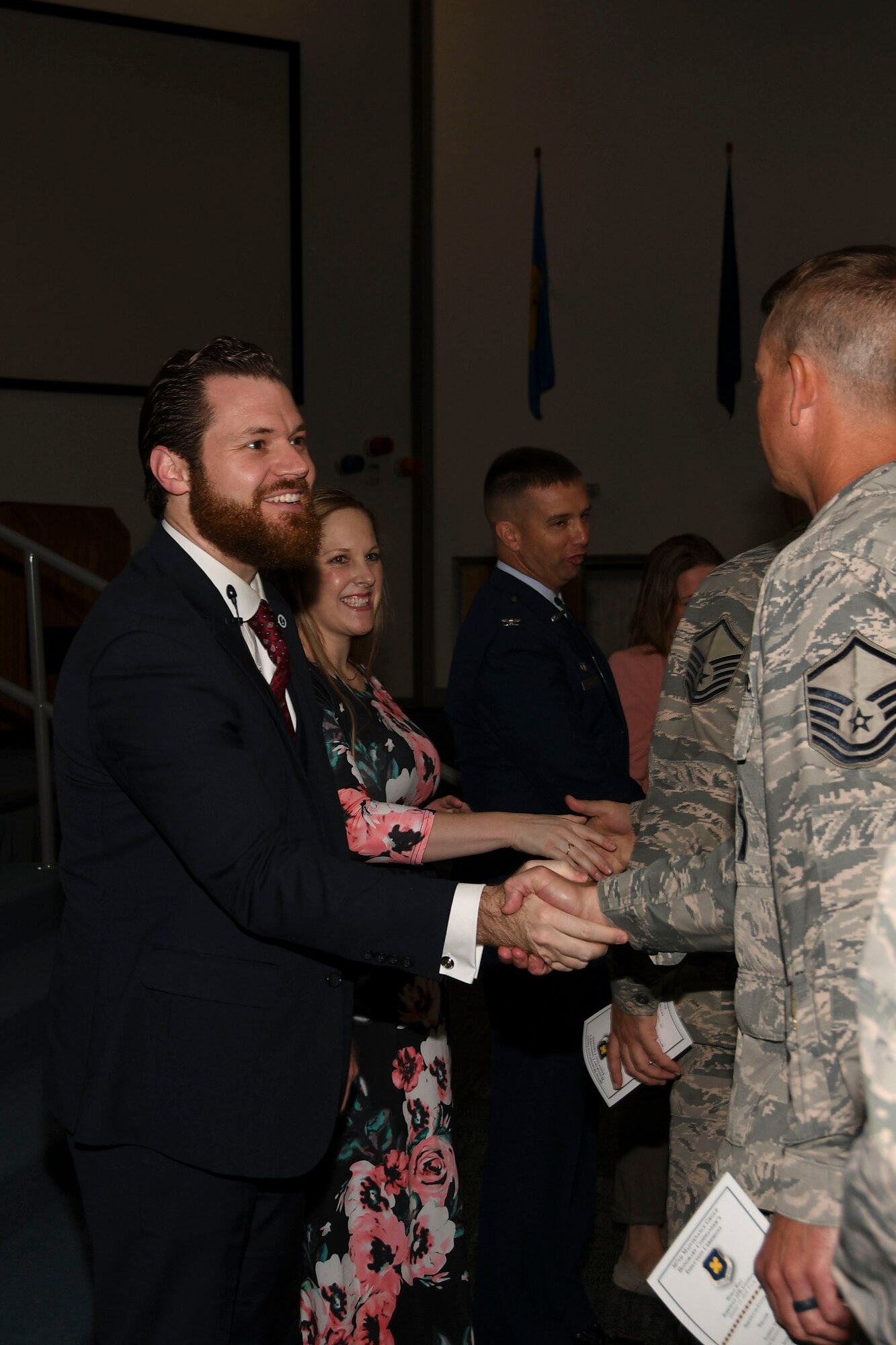 Christopher Steinsholt, 307th Maintenance Group honorary commander, and his wife, Natalie, greet Citizen Reserve Airman from the unit after an induction ceremony at Barksdale Air Force Base, Louisiana, Oct. 13, 2018.   The Steinsholts are both prior Air Force with experience working on the B-52 Stratofortress.   (U.S. Air Force photo by Staff Sgt. Callie Ware)