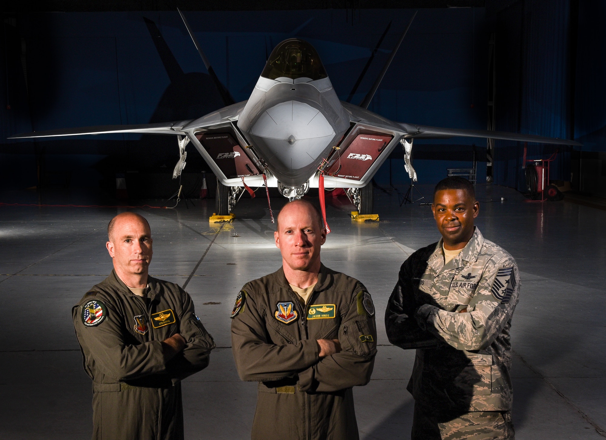 U.S. Air Force Col. Jason Hinds (center), 1st Fighter Wing commander; U.S. Air Force Col. Steve Fino (left), 1st FW vice commander; and U.S. Air Force Chief Master Sergeant Johnny Harris, 1st FW command chief, pose for a photo in front of an F-22 Raptor from the 1st FW at Joint Base Langley-Eustis, Virginia, Oct. 10, 2018. The 100-year-old 1st FW is home to the 94th Fighter Squadron, 27th FS and the 71st Fighter Training Squadron. (U.S. Air Force photo by Staff Sgt. Carlin Leslie/Released)