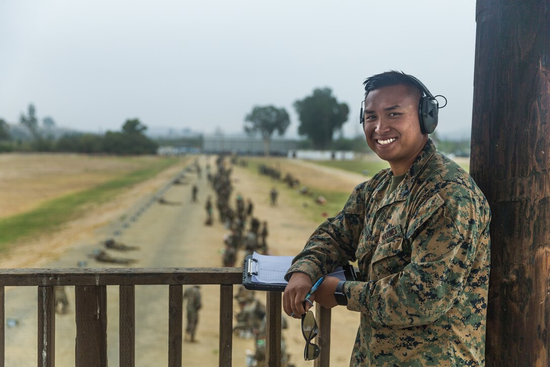 U.S. Marine Corps Cpl. Huy Nguyen, combat marksmanship trainer, 7th Engineer Support Battalion, 1st Marine Logistics Group, in the Wilcox Rifle Range tower at Marine Corps Base Camp Pendleton, California, Sept. 26, 2018. (U.S. Marine Corps photo by Lance Cpl. Kerstin Roberts)