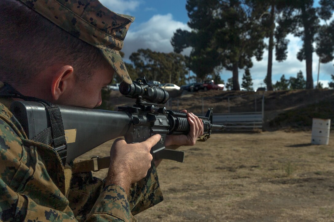 U.S. Marine Corps Lance Cpl. Michael Barsella, legal service specialist, Headquarters and Support Battalion, Marine Corps Base (MCB) Camp Pendleton, aims in on a firing barrel while “snapping in” at Marine Corps Base Camp Pendleton, California, Oct. 5, 2018. "Snapping in" is the term used to describe practicing dry-firing with an empty weapon before live-firing. (U.S. Marine Corps photo by Lance Cpl. Kerstin Roberts)
