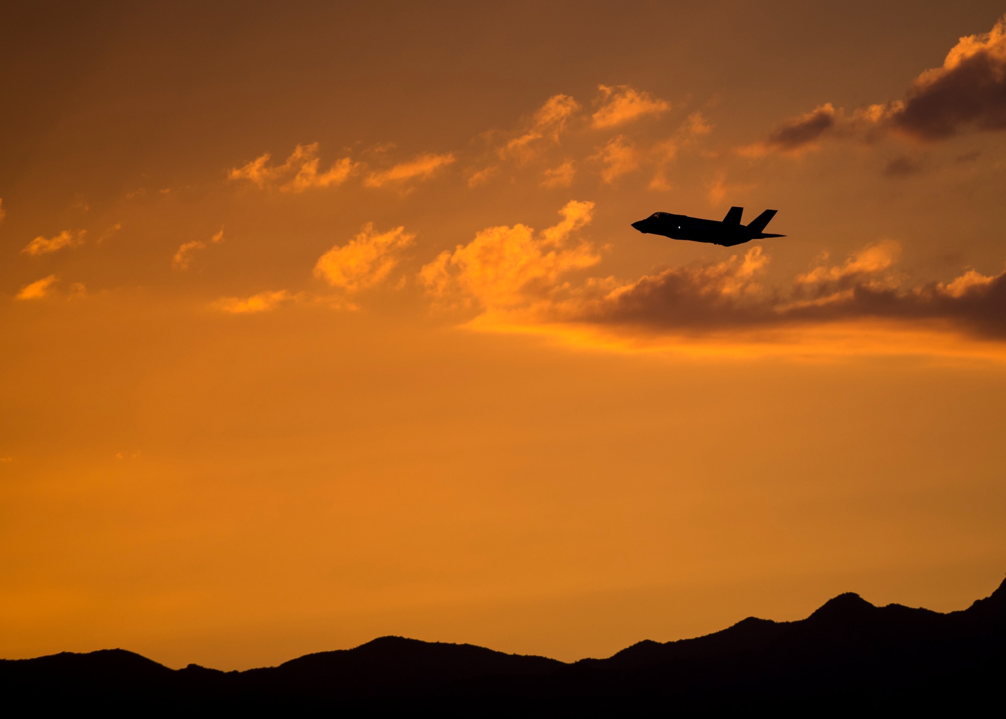 An F-35A Lightning II fighter jet flies over Luke Air Force Base, Ariz., Oct. 11, 2018. Luke AFB conducts F-35 night flying training operations to ensure that pilots are trained to their maximum ability. (U.S. Air Force Photo by Airman 1st Class Jacob Wongwai)