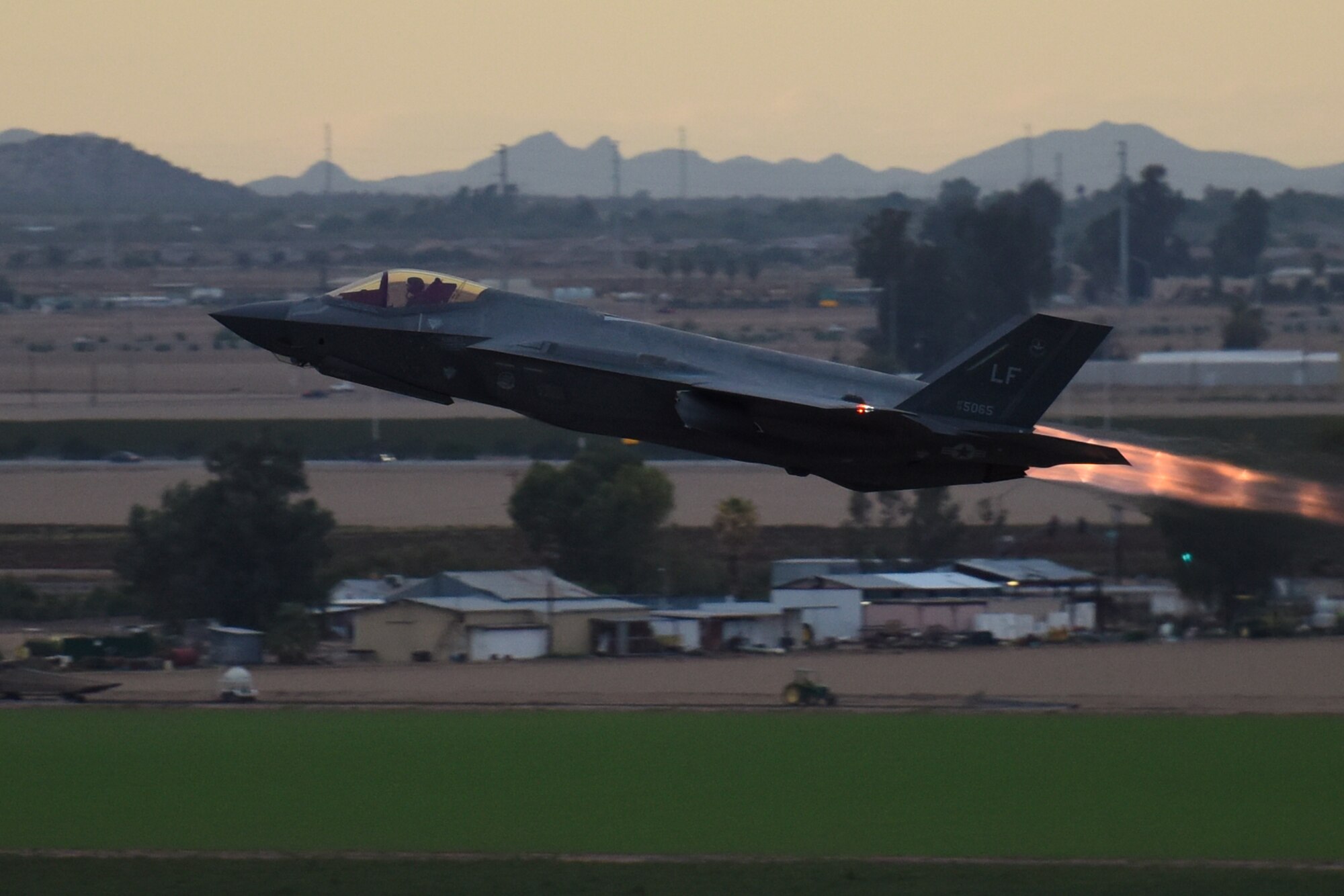 A 62nd Fighter Squadron F-35A Lightning II takes off for an evening sortie Oct. 11, 2018, from Luke Air Force Base, Ariz. Pilots conduct periodic, routine night flying in order to train for nighttime and low light operations. (U.S. Air Force photo by Senior Airman Ridge Shan)