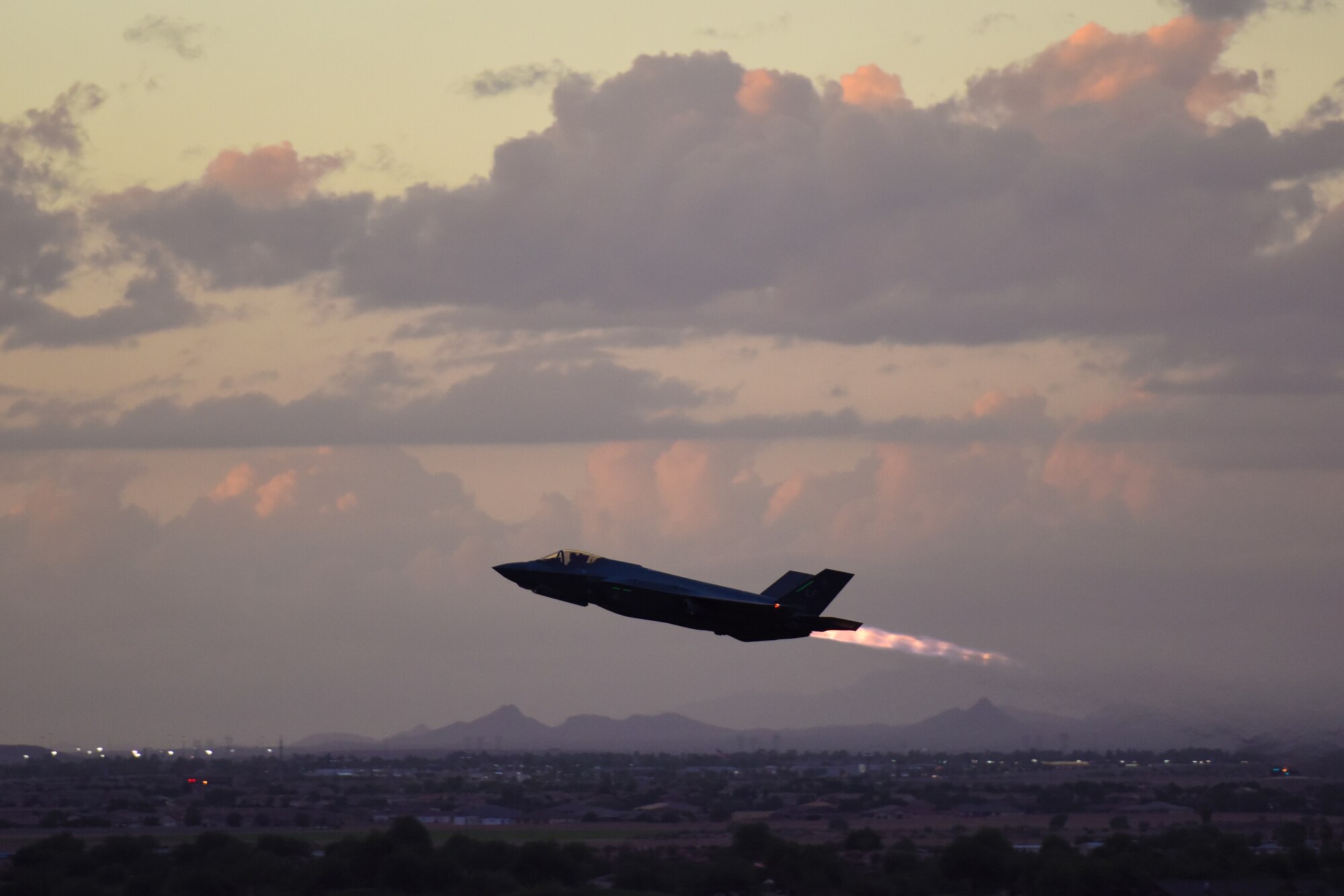 An F-35A Lightning II takes off for a nighttime sortie Oct. 11, 2018, over Luke Air Force Base, Ariz. Pilots train to fly during the night using night-vision optics and flight instruments. (U.S. Air Force photo by Senior Airman Ridge Shan)
