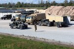 A 38th Infantry Division Soldier guides a Humvee at Camp Atterbury near Edinburgh, Indiana, during the unit’s warfighter exercise, Oct. 9, 2018.