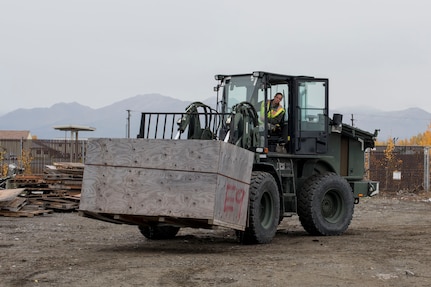 U.S. Air Force Airman 1st Class Pamela Proteau, a 773d Logistics Readiness Squadron vehicle operator, picks up a crate using a 10k all-terrain forklift to remove wreckage debris at Joint Base Elmendorf-Richardson, Alaska, Sept. 27, 2018. Proteau was part of a large wreckage disposal team whose mission was to remove debris from the fatal crash of the Sitka 43 C-17 Globemaster III that had been stored at JBER since 2010. After multiple shipments, the ‘Sitka 43’ wreckage is finding a new purpose at the Air Force Safety Center (AFSEC) Crash Lab at Kirtland Air Force Base, N.M.