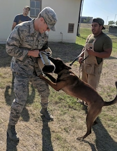 Cadet Dargle (left) with Jean Villanueva, a Military Working Dog Breeding Program Training Instructor.