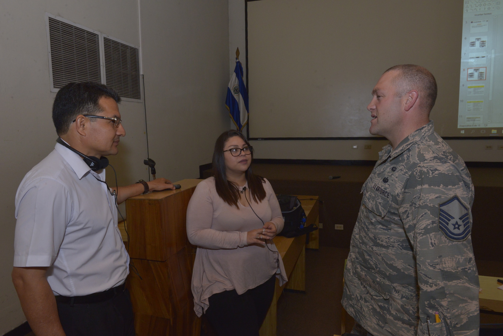 Ramon Argueta, an IT network security technician, discusses communication organizational structure with U.S. Air Force Master Sgt. Gabriel Howard, a cyber transport specialist assigned to the 157th Communications Flight, New Hampshire Air National Guard, by way of Interpreter Ms. Maggie Vega, San Salvador, El Salvador, Sept. 27, 2018. Howard is part of a multi-state National Guard State Partnership Program, headed by the New Hampshire National Guard, in order to help assess and determine recommendations for the Salvadoran Army as they stand up a cyber security unit. (N.H. Air National Guard photo by Tech. Sgt. Aaron Vezeau)