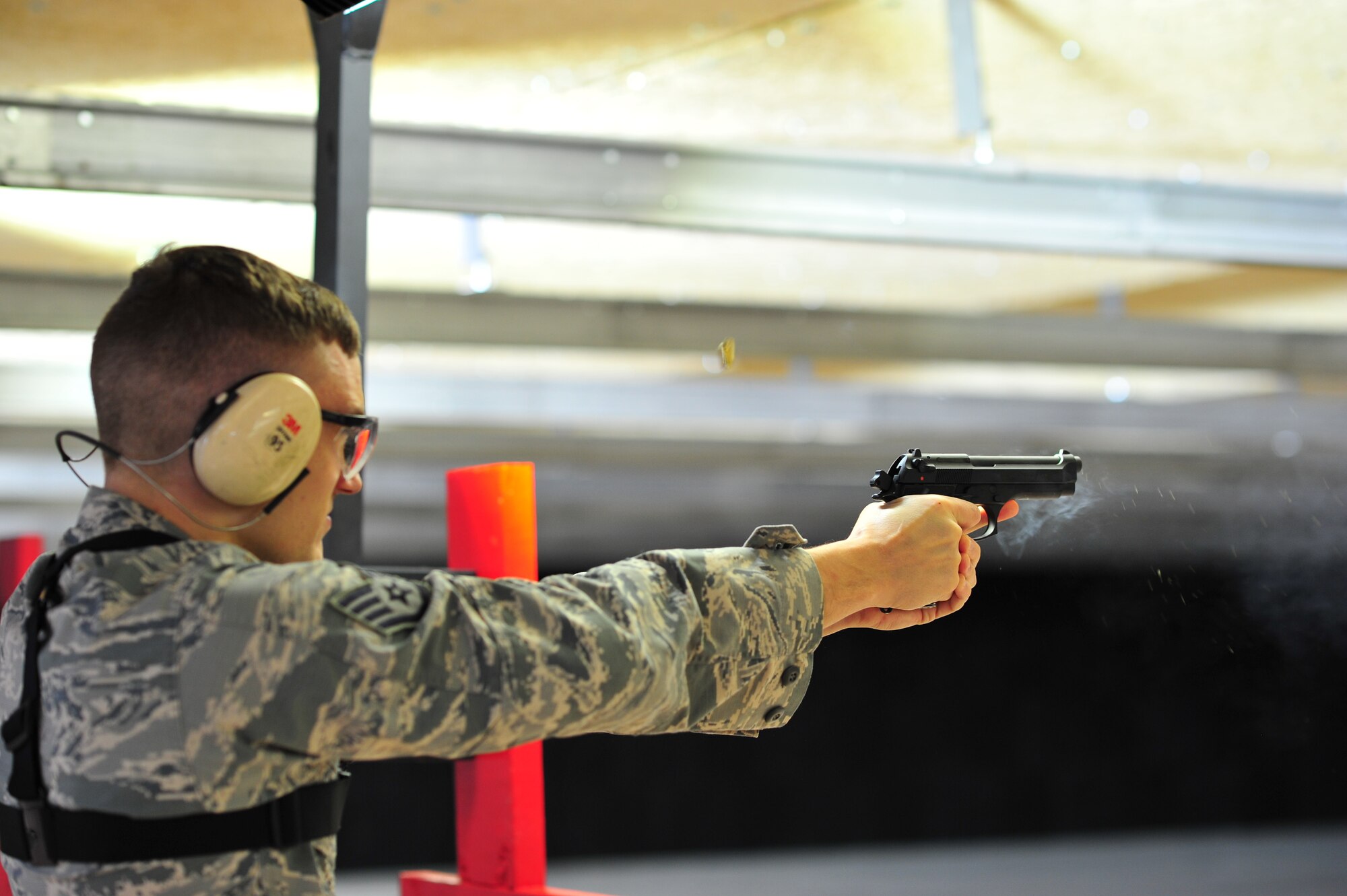 Staff Sgt. Jeffrey Grossi, a photojournalist with the 910th Airlift Wing, fires an M9 at a target at Youngstown Air Reserve Station’s new Combat Arms Training and Maintenance firing range Oct. 13, 2018.