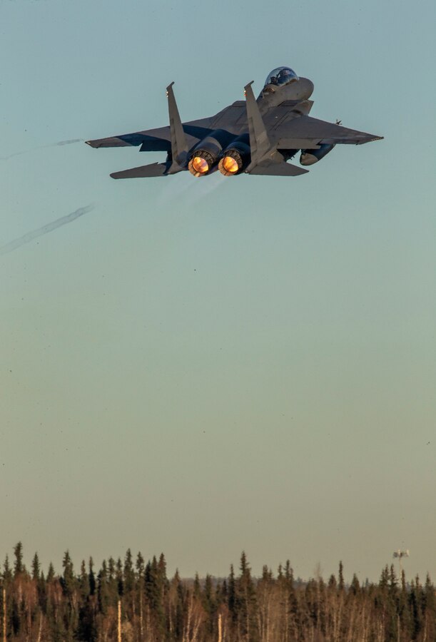 A Republic of Korea Air Force F-15K Slam Eagle fighter aircraft is in flight during exercise Red Flag-Alaska (RF-A) 19-1 at Eielson Air Force Base, Alaska, Oct. 8, 2018. Red Flag is a series of U.S. Pacific Air Force commander-directed field training exercise for U.S. and coalition forces to provide a realistic joint offensive counter-air, interdiction, close air support and large-force employment training in a simulated combat environment. (U.S. Marine Corps photo illustration by Sergeant Maria A. Noyola)(This photo has been altered for security purposes by blurring the aircraft identification tags)