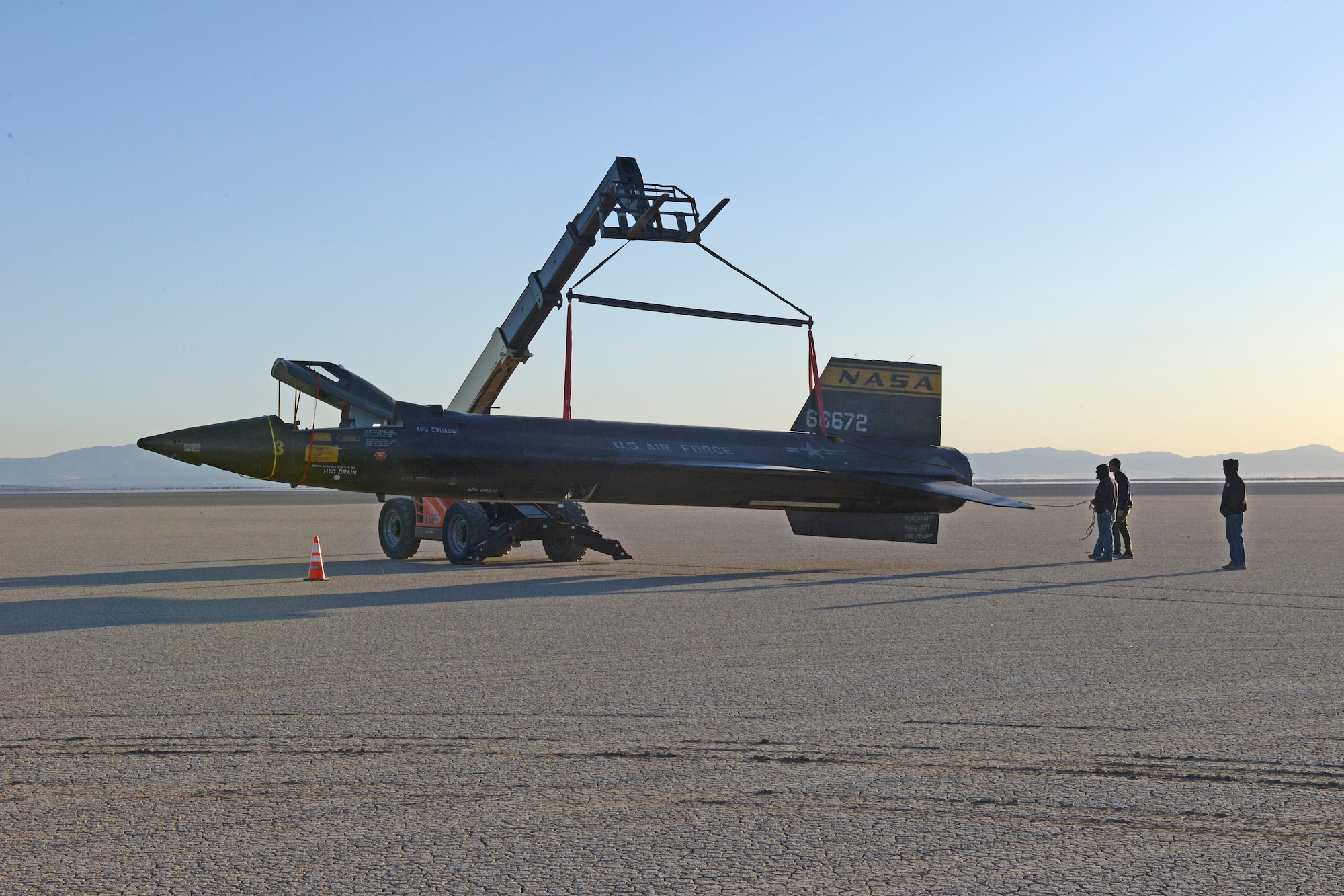 A mockup of an X-15 rocket plane being placed on Rosamond Dry Lakebed at Edwards Air Force Base, California, Feb. 21, 2018, for a scene in the film "First Man." (U.S. Air Force photo by Kenji Thuloweit