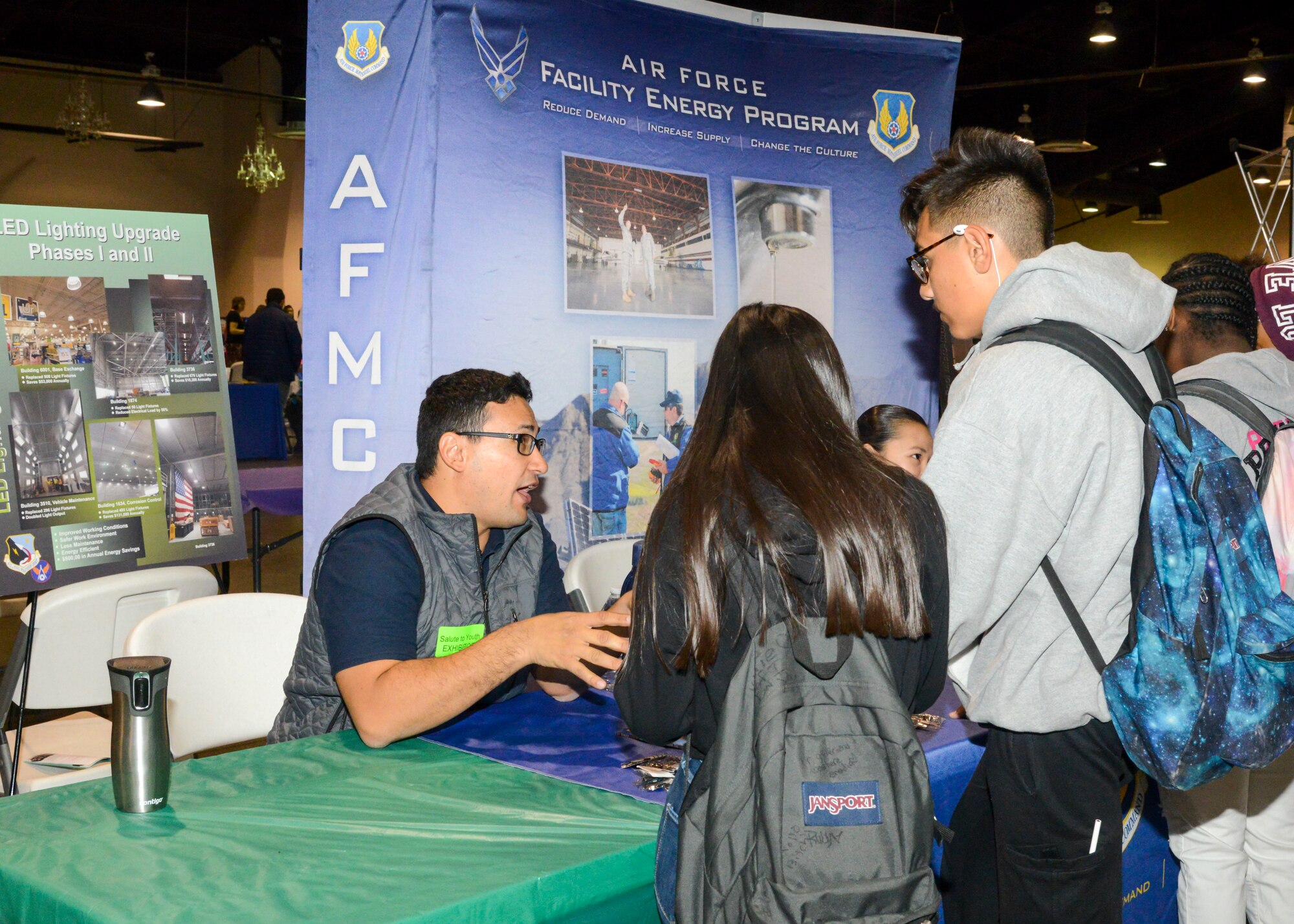 Bayram Kurbanov, an engineer with 412th Civil Engineer Group at Edwards Air Force Base, talks with high school students about his job as an engineer during the 27th annual Salute to Youth career fair at the Antelope Valley Fair and Event Center in Lancaster, California, Oct. 11. (U.S. Air Force photo by Giancarlo Casem)