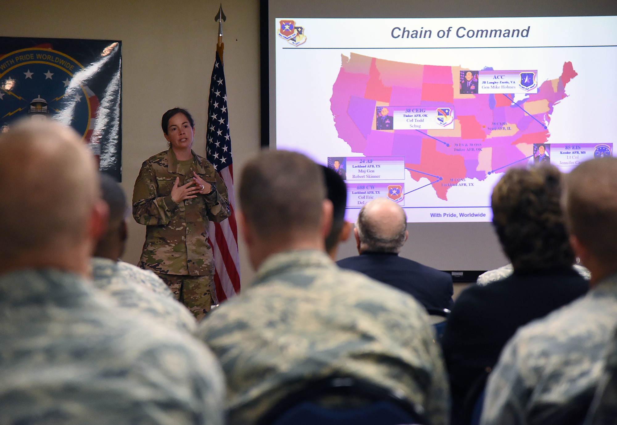 U.S. Air Force Lt. Col. Jennifer Carns, 85th Engineering Installation Squadron commander, delivers a mission briefing during an open house inside Maltby Hall at Keesler Air Force Base, Mississippi, Oct. 11, 2018. Tower rescue and fiber splicing demonstrations were conducted as well as tours inside the tool cage, telecommunications lab and the electromagnetics lab. (U.S. Air Force photo by Kemberly Groue)