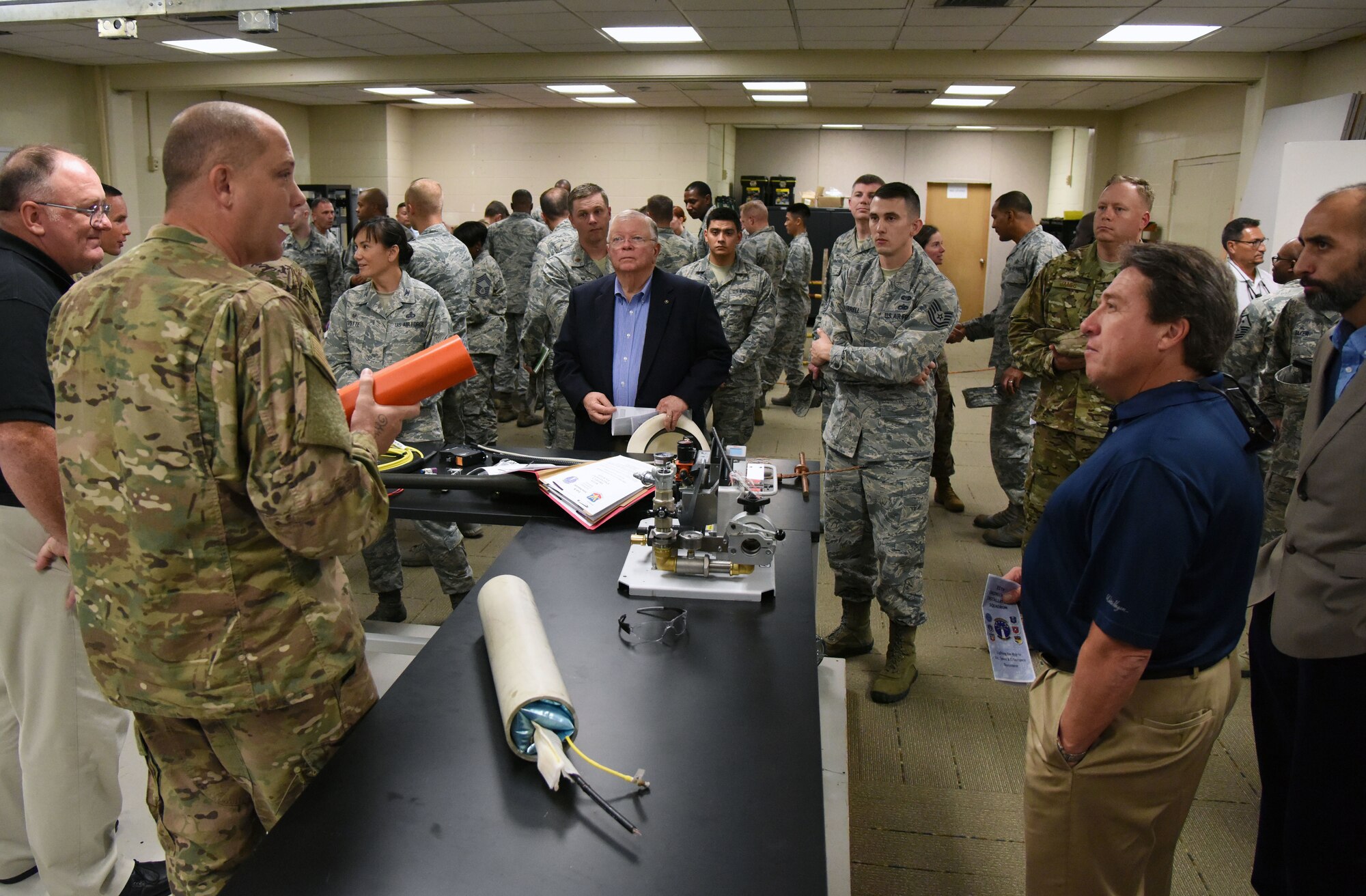 U.S. Air Force Tech. Sgt. Michael Williams, 85th Engineering Installation Squadron project engineering NCO in charge, briefs on fiber optic cable equipment during an open house inside Maltby Hall at Keesler Air Force Base, Mississippi, Oct. 11, 2018. Keesler leadership and personnel attended the event to become more familiar with the 85th EIS mission capabilities. (U.S. Air Force photo by Kemberly Groue)